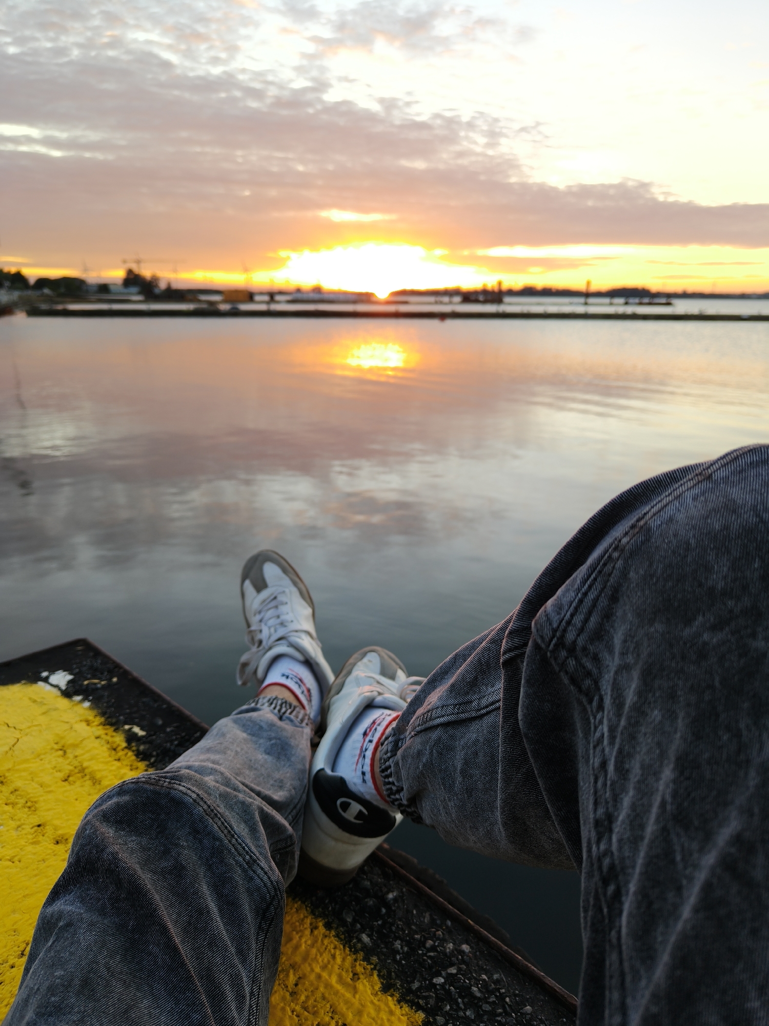 Sunset over the Bay of Puck from a quiet pier