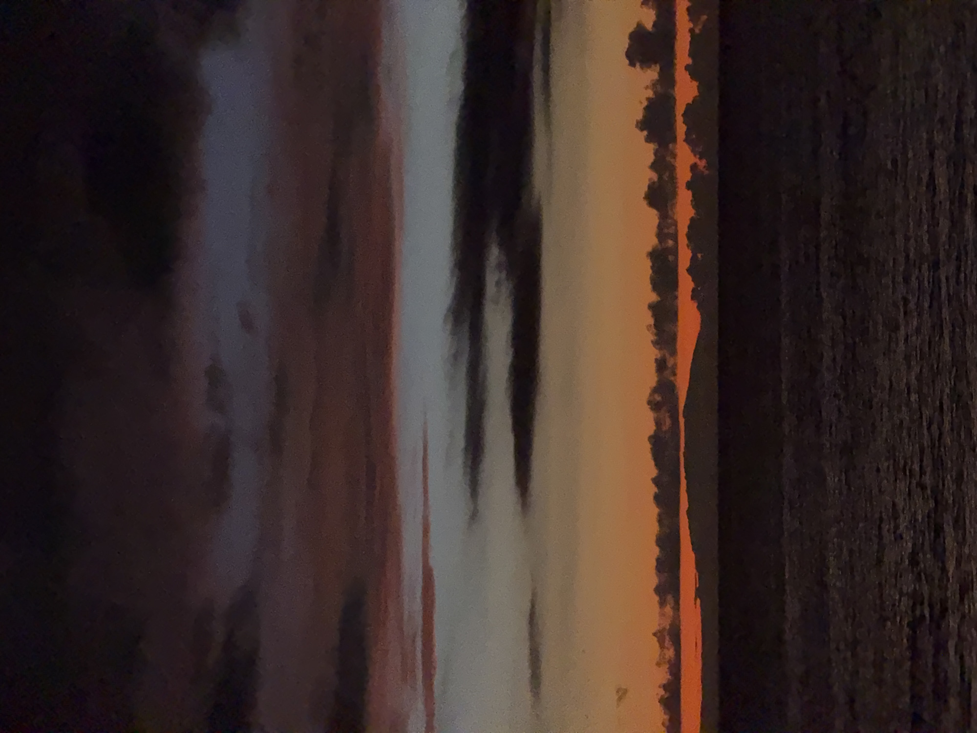 Adeje beachfront after dark, sculptures and shoreline