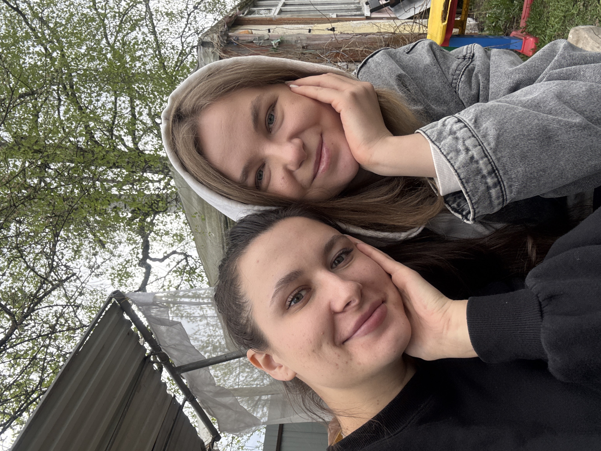 Two women take outdoor selfie together