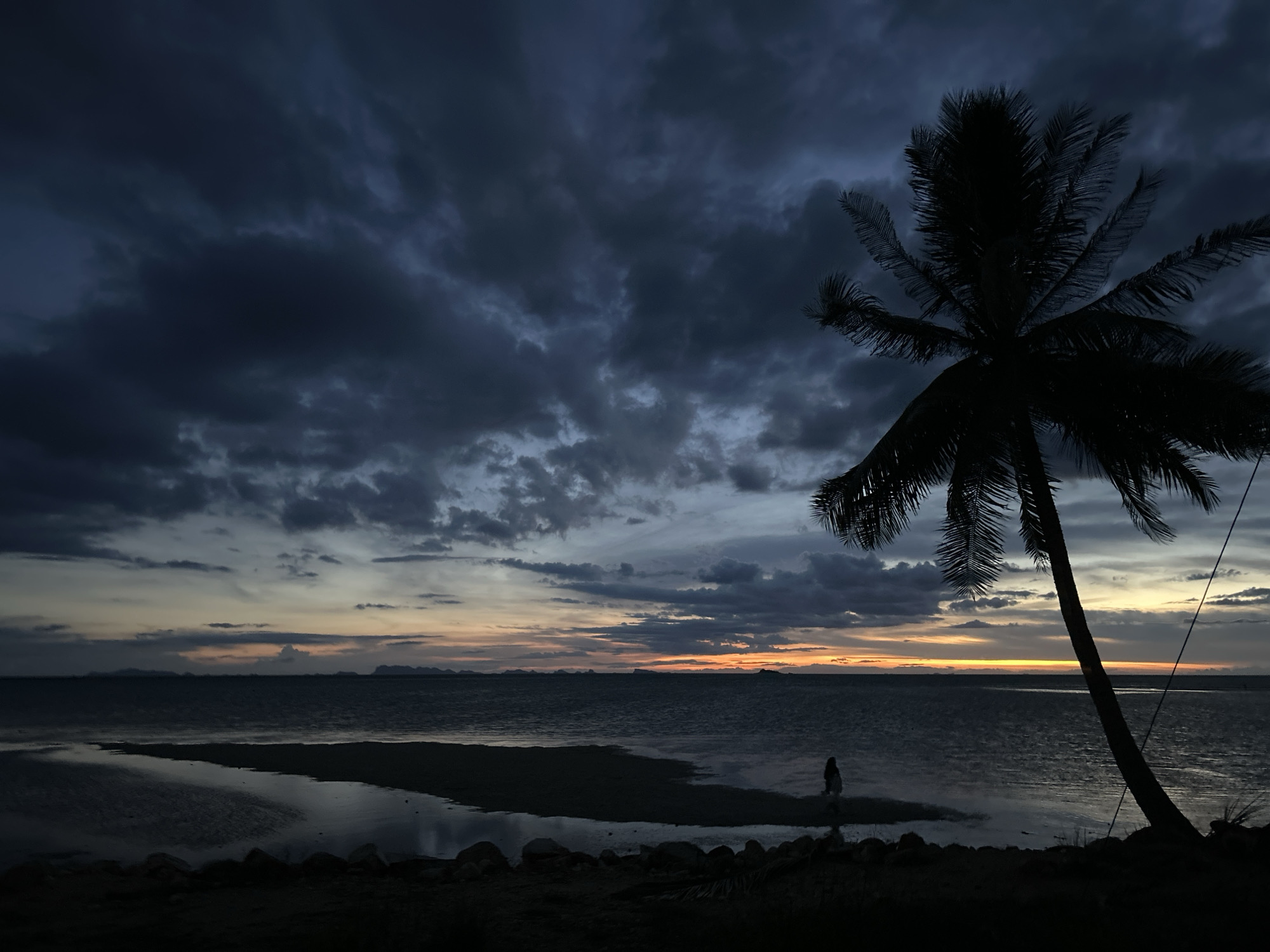 Lone figure photographed at dusk on Ko Phangan beach