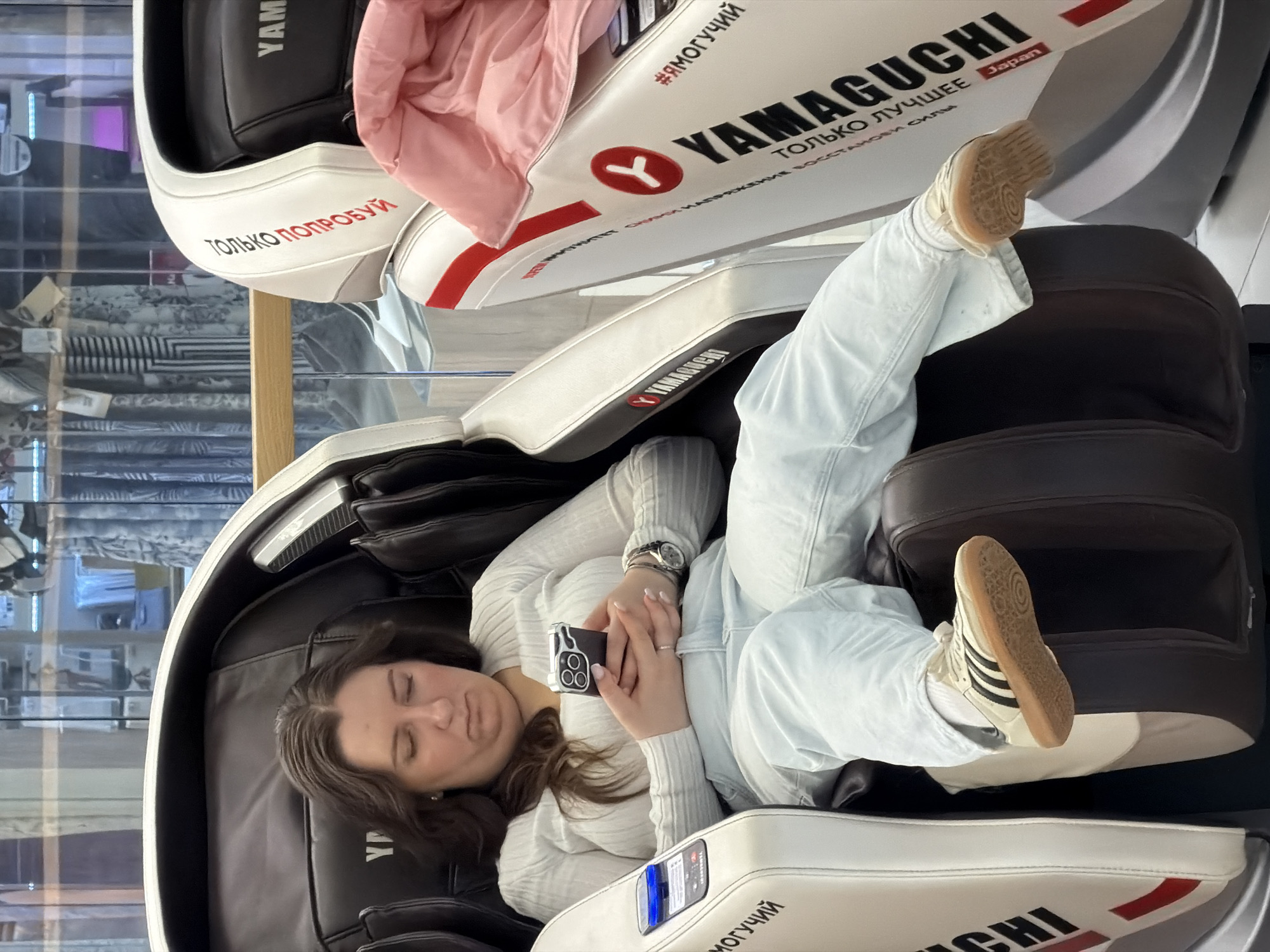Woman tests Yamaguchi massage chair at Moscow store