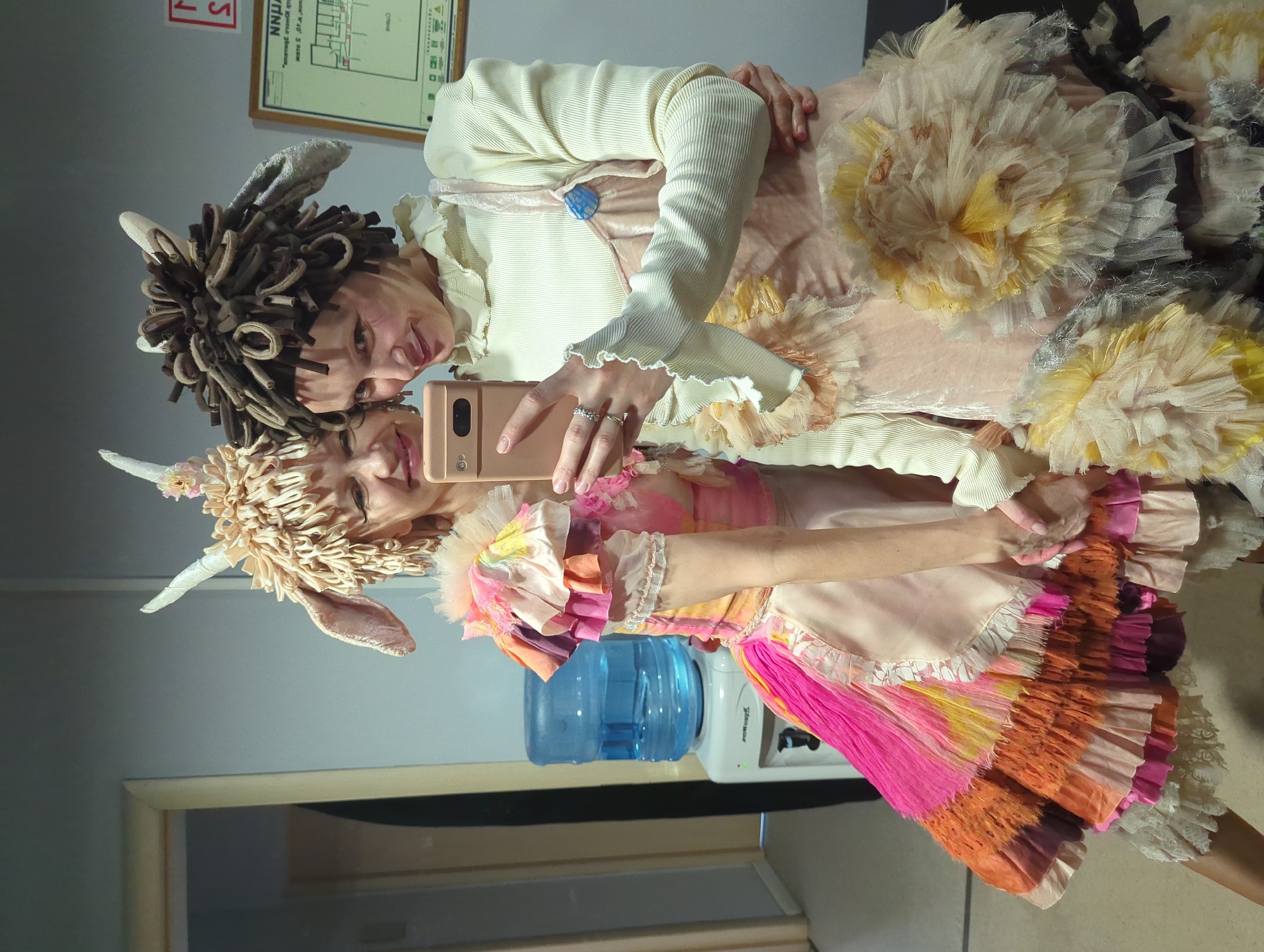 Costumed women take selfies at Moscow venue