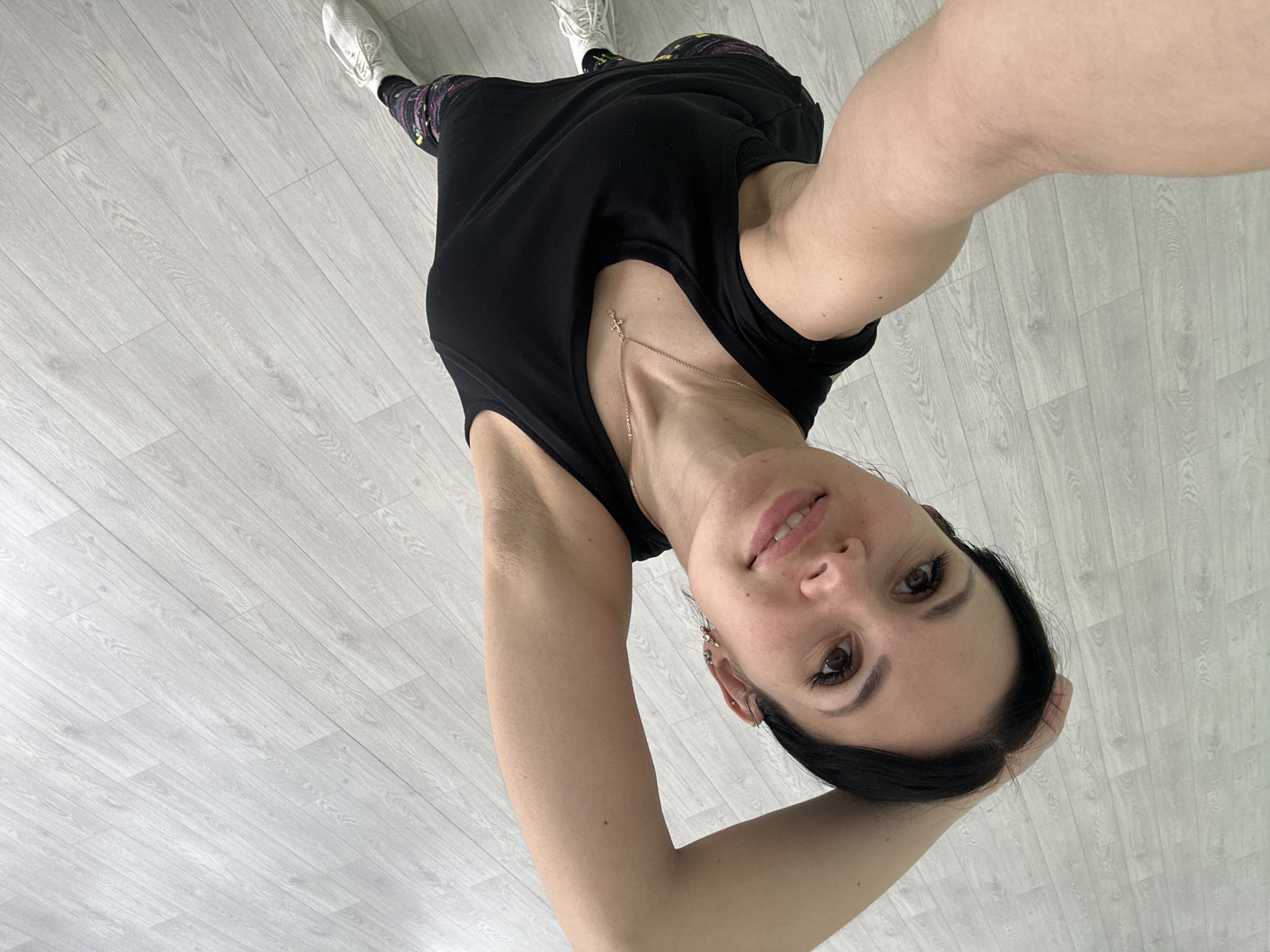 Woman Takes Indoor Selfie at Urban Location