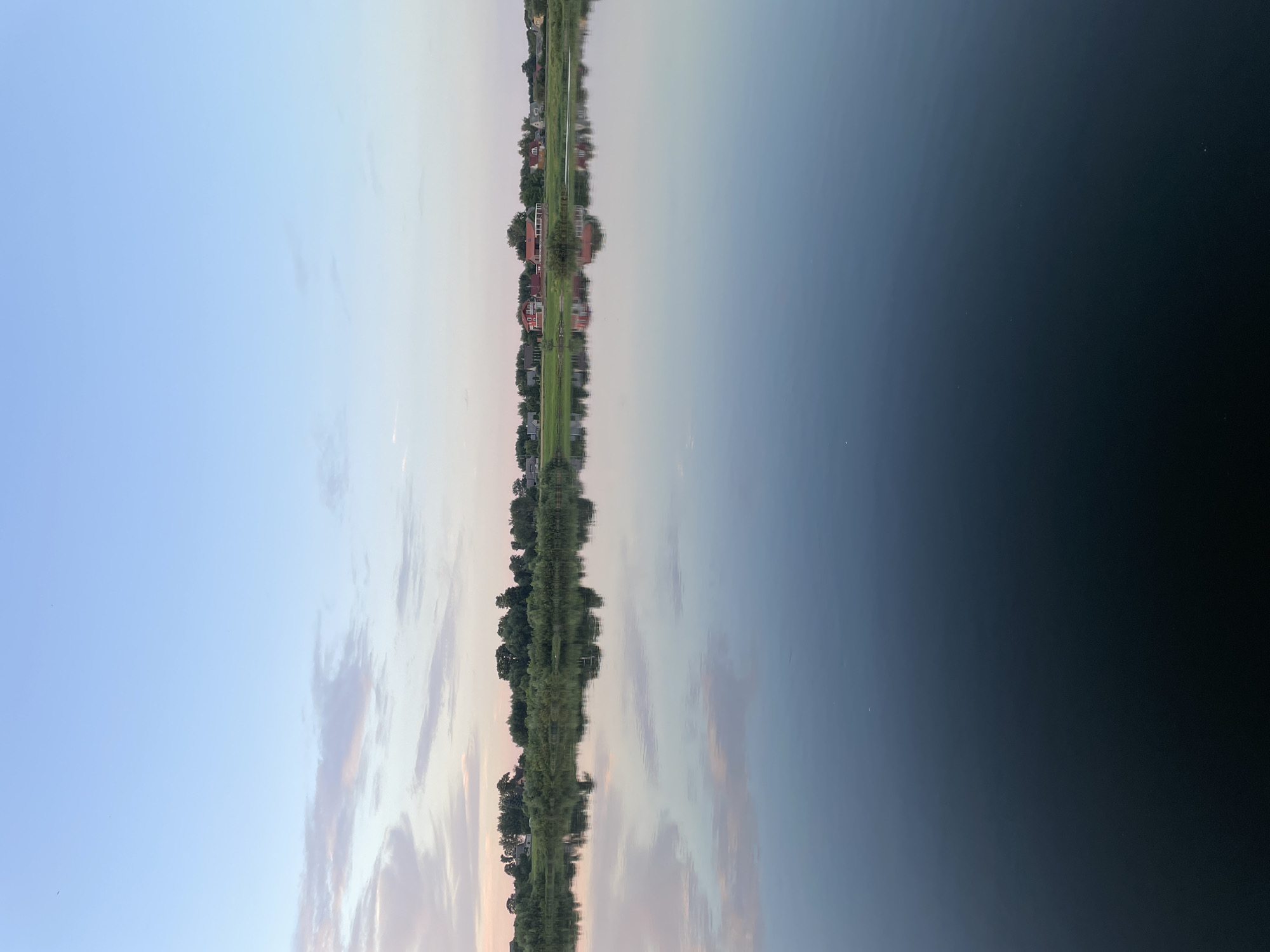 Sovetsk railway bridge at golden hour over the Neman River