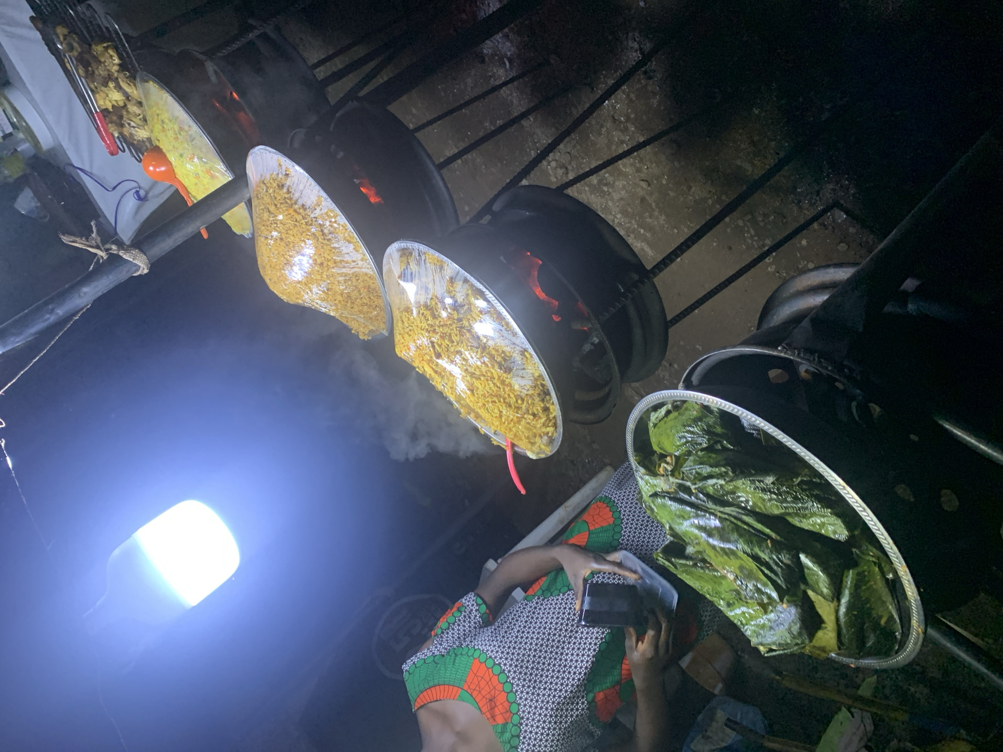 Street vendor prepares traditional dishes in Gwarinpa, Nigeria