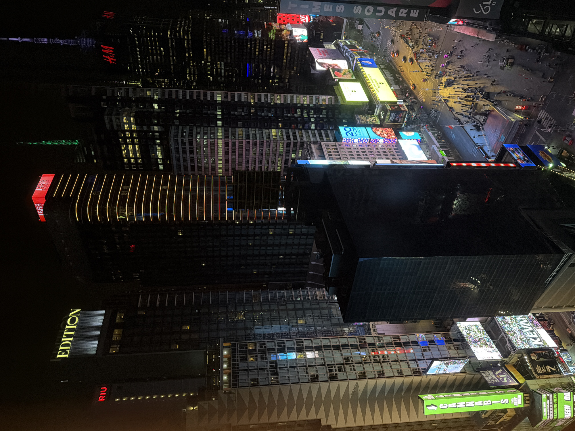 Aerial view captures nighttime Times Square scene early morning