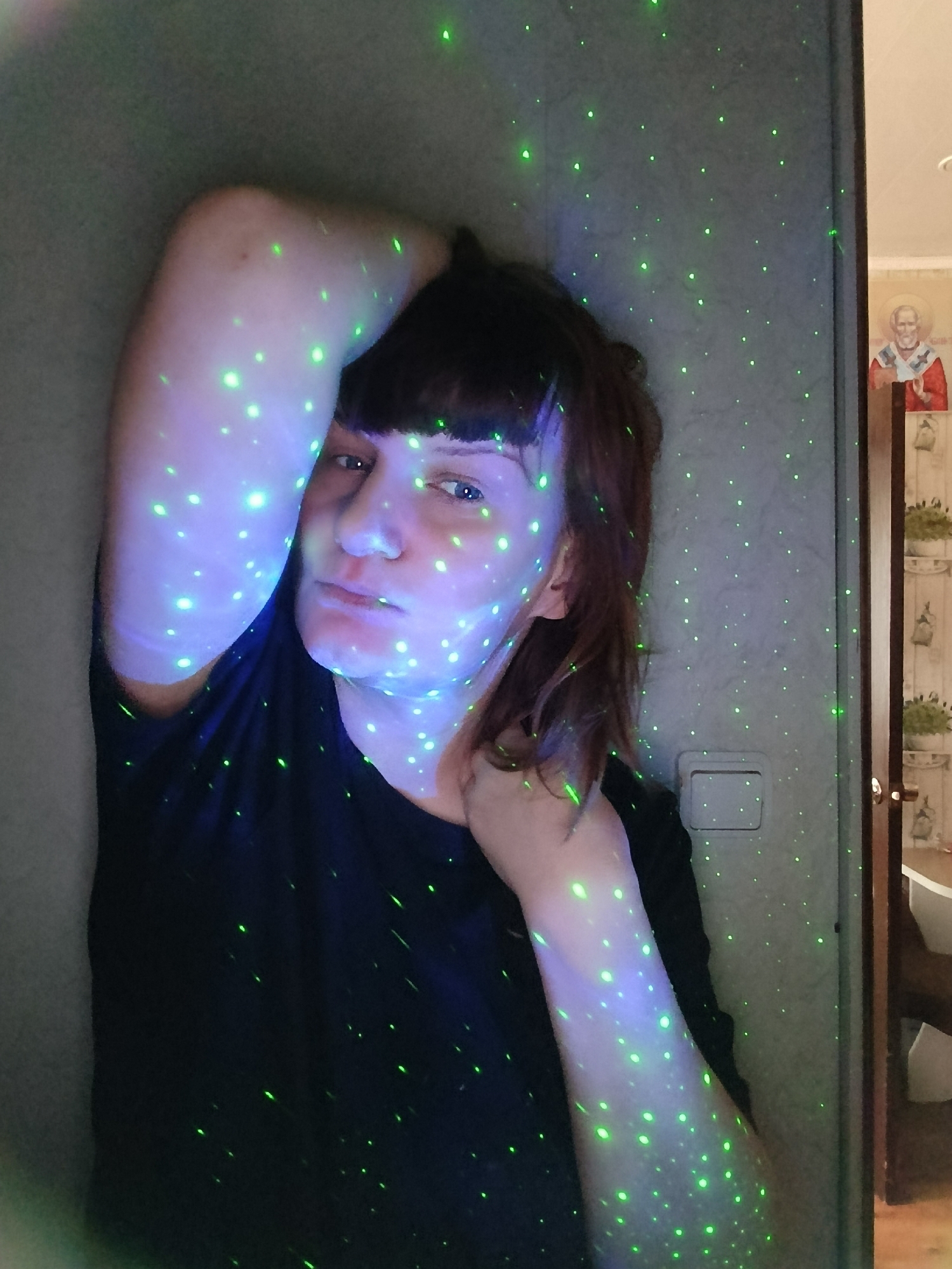 Individual photographed indoors with hand gesture captured by witness
