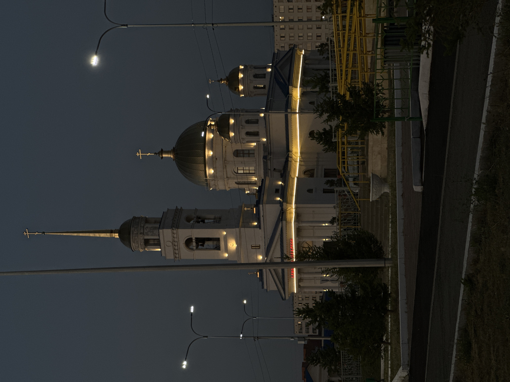 Kokshetau at dusk: lakefront, cathedral, and city lights.