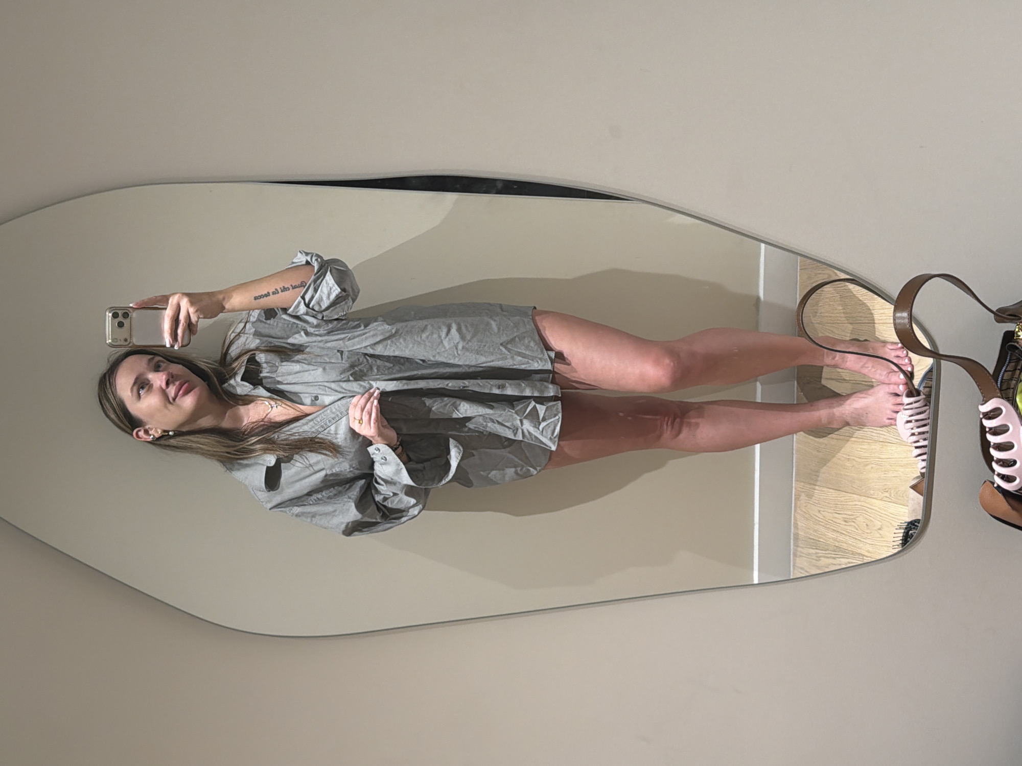 Woman takes mirror selfies in upscale restroom facilities