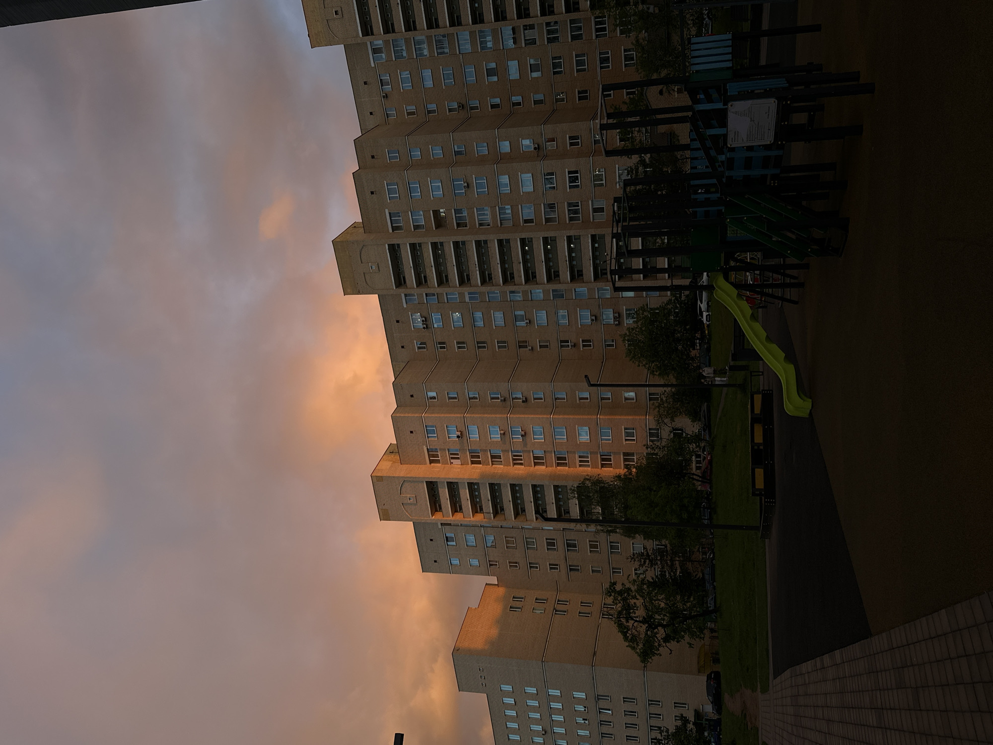 Evening documentation of modern Minsk buildings and rainbow at dusk