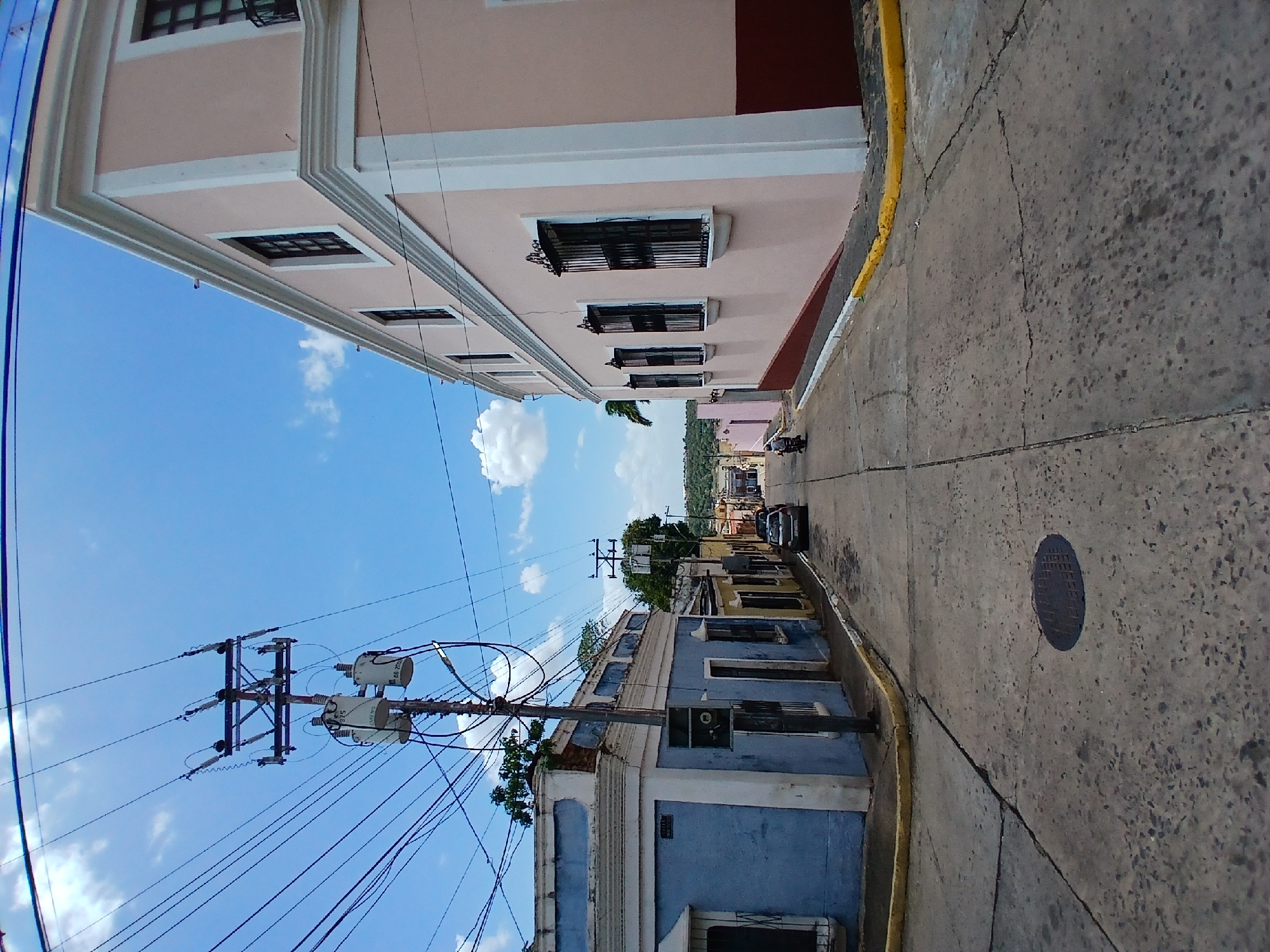 Tourist documents Ciudad Bolivar architecture and South American flag display