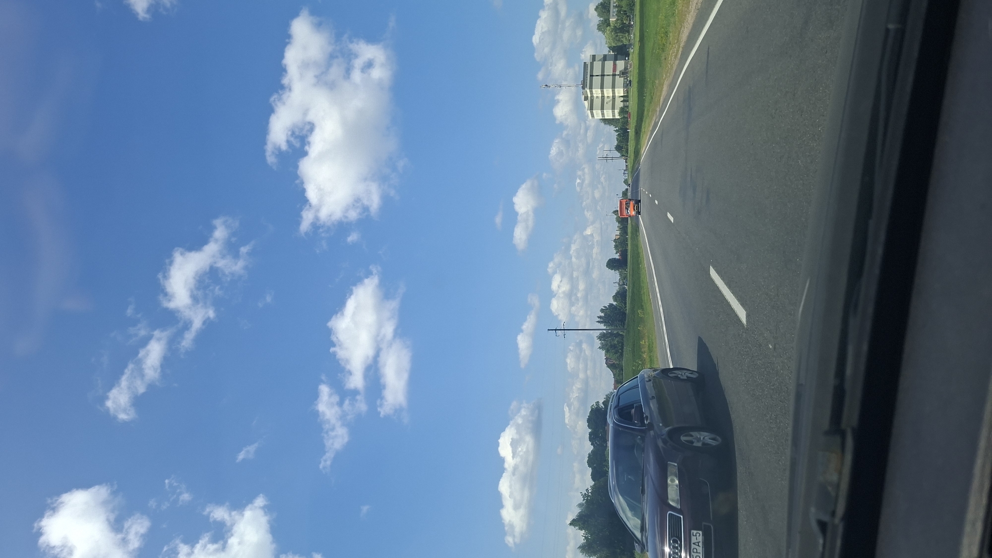 Rolling through Myadzyel's sunny streets on a July morning