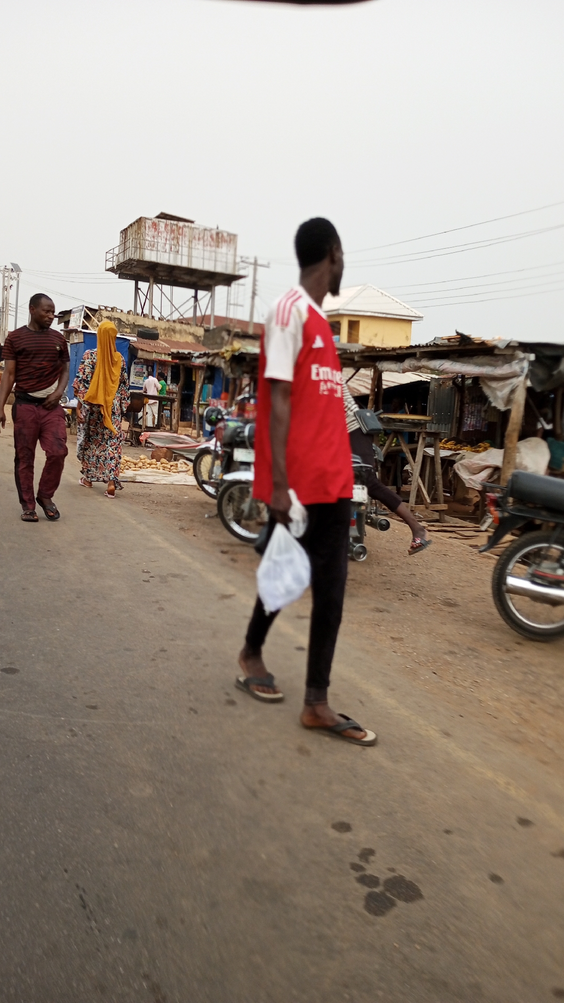 Morning street life captured across Adankolo Nigeria neighborhood