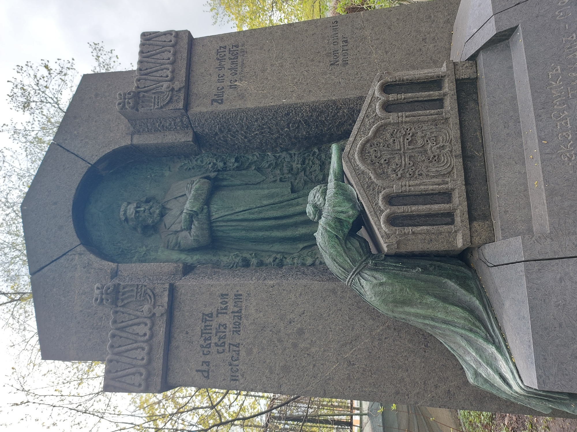 Visitor documents Russian artists' graves at Saint Petersburg cemetery