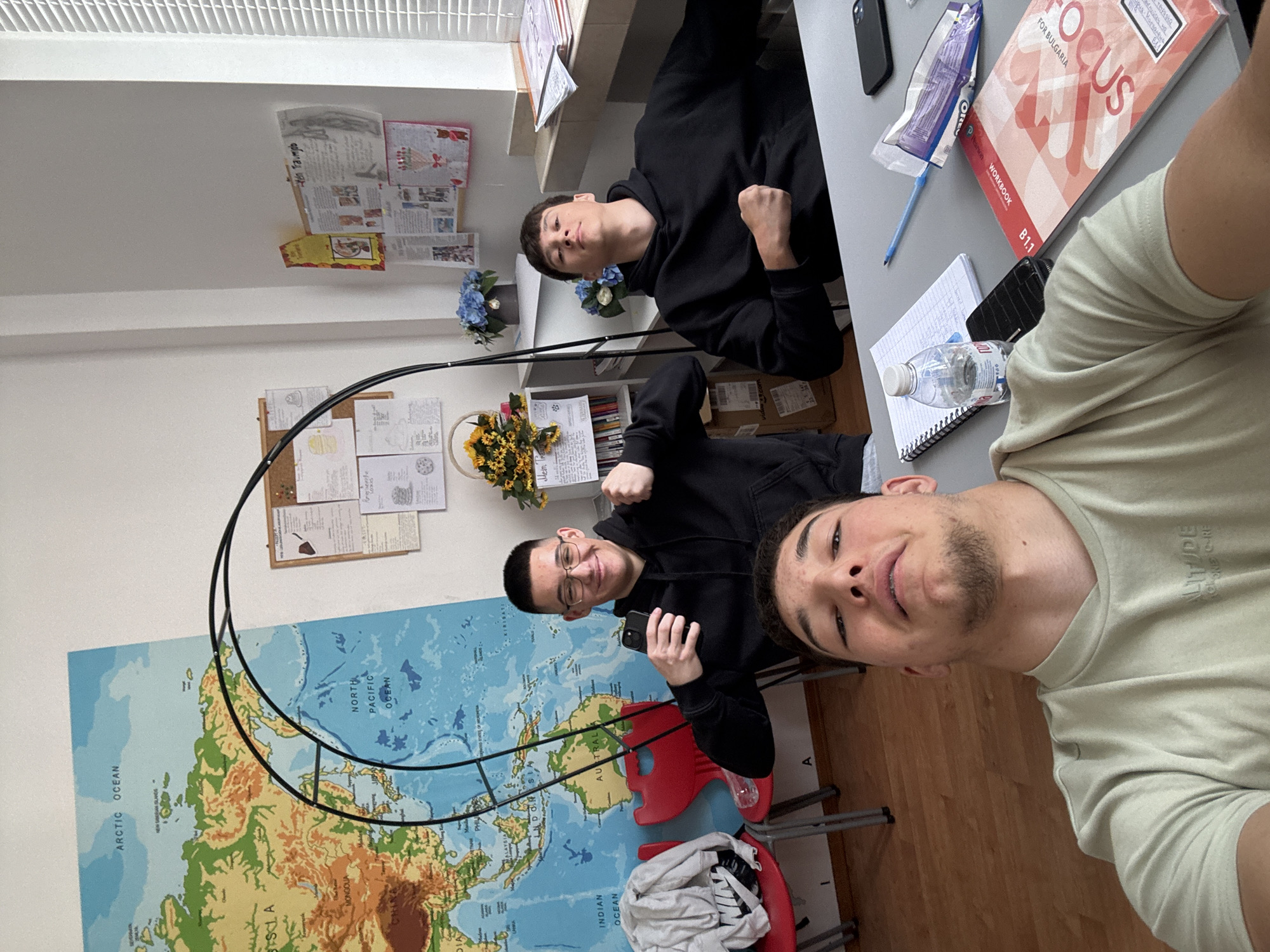 Students photograph turtle toy during classroom session in Zlatograd