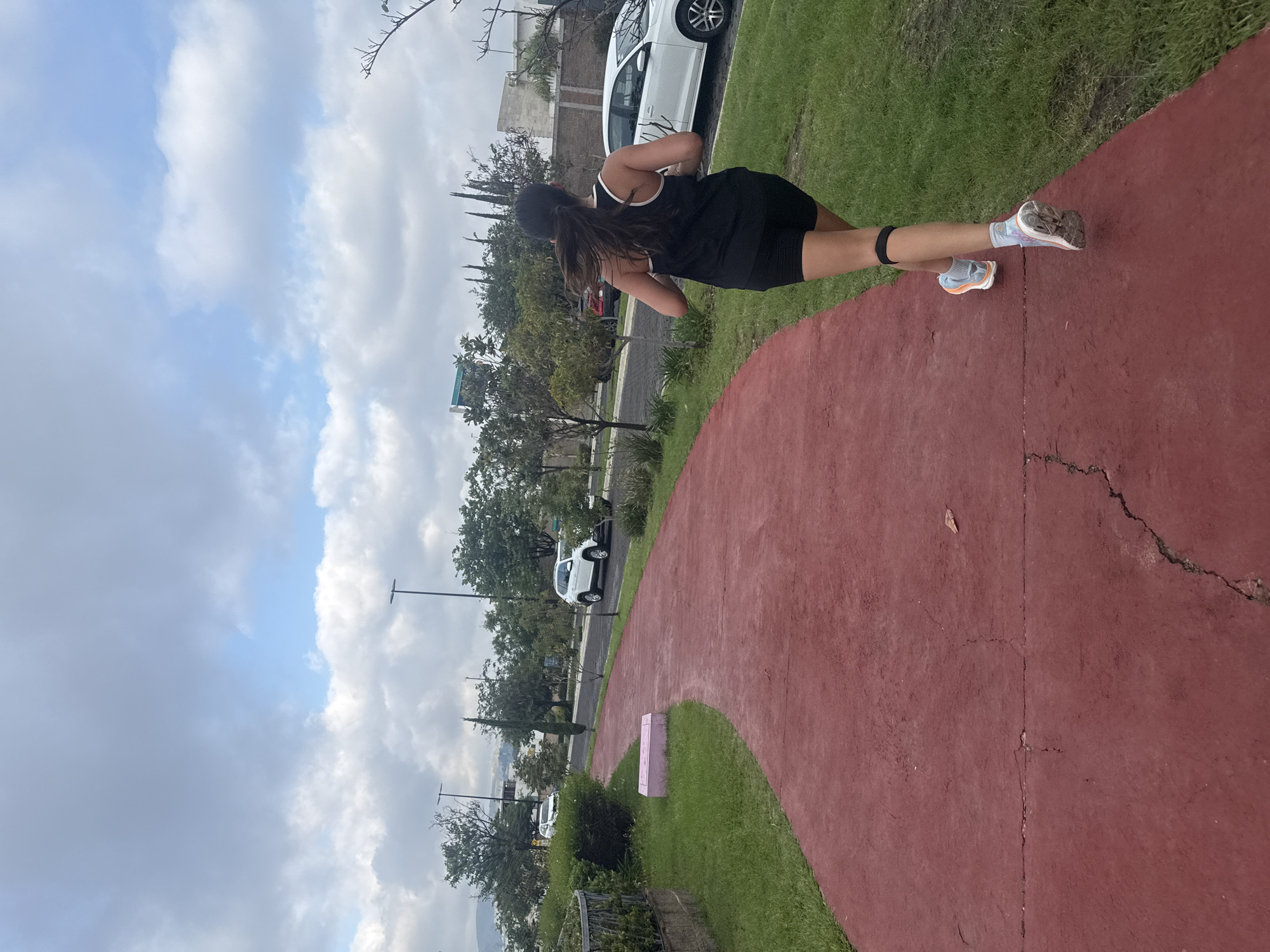 Running on a red path through a Puebla-area park
