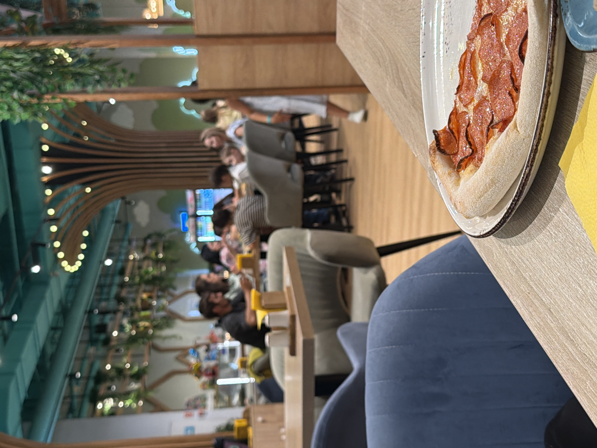 Pizza, sushi, and milkshake menus at a Kazan themed cafe
