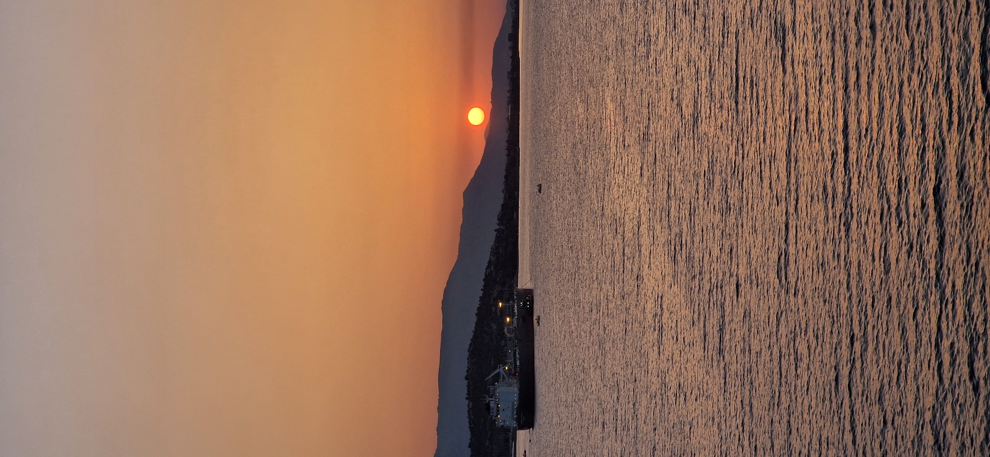 Golden sunset over the Greek coastline at Agioi Theodoroi