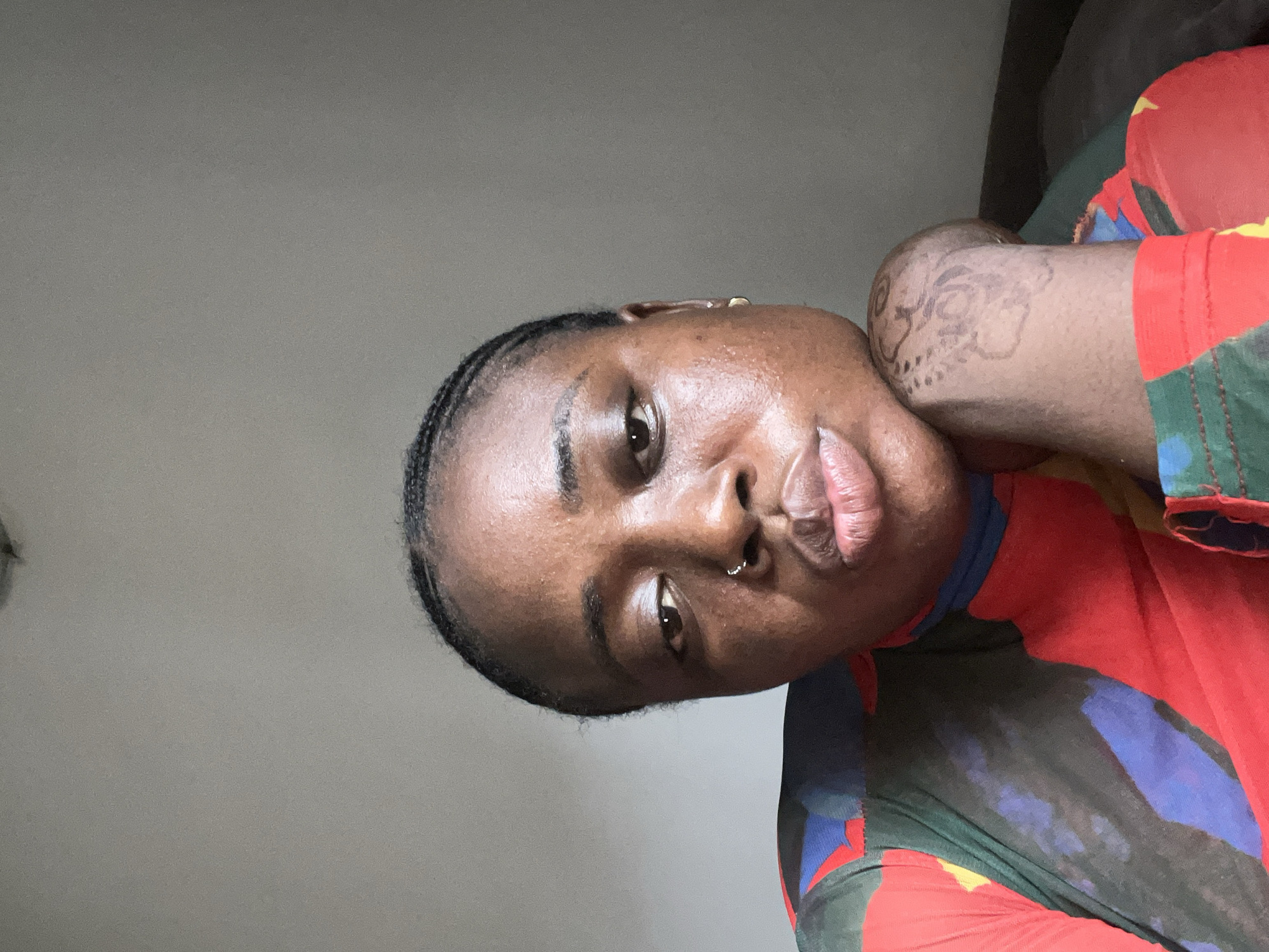 Person takes colorful selfie session in Abuja home