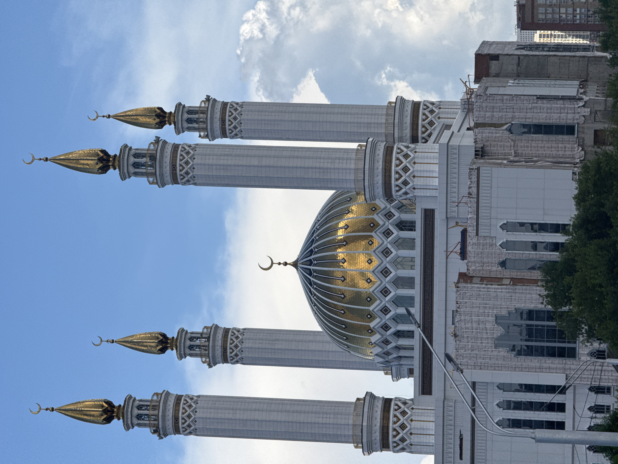 Drive through Kazan featuring mosque views and spring flowers