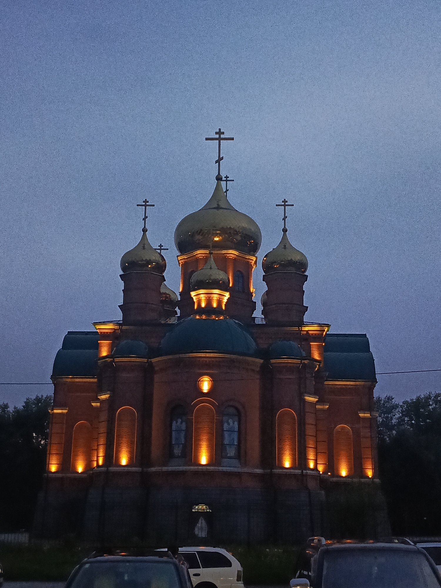 Barnaul's Orthodox churches glow at dusk from multiple angles