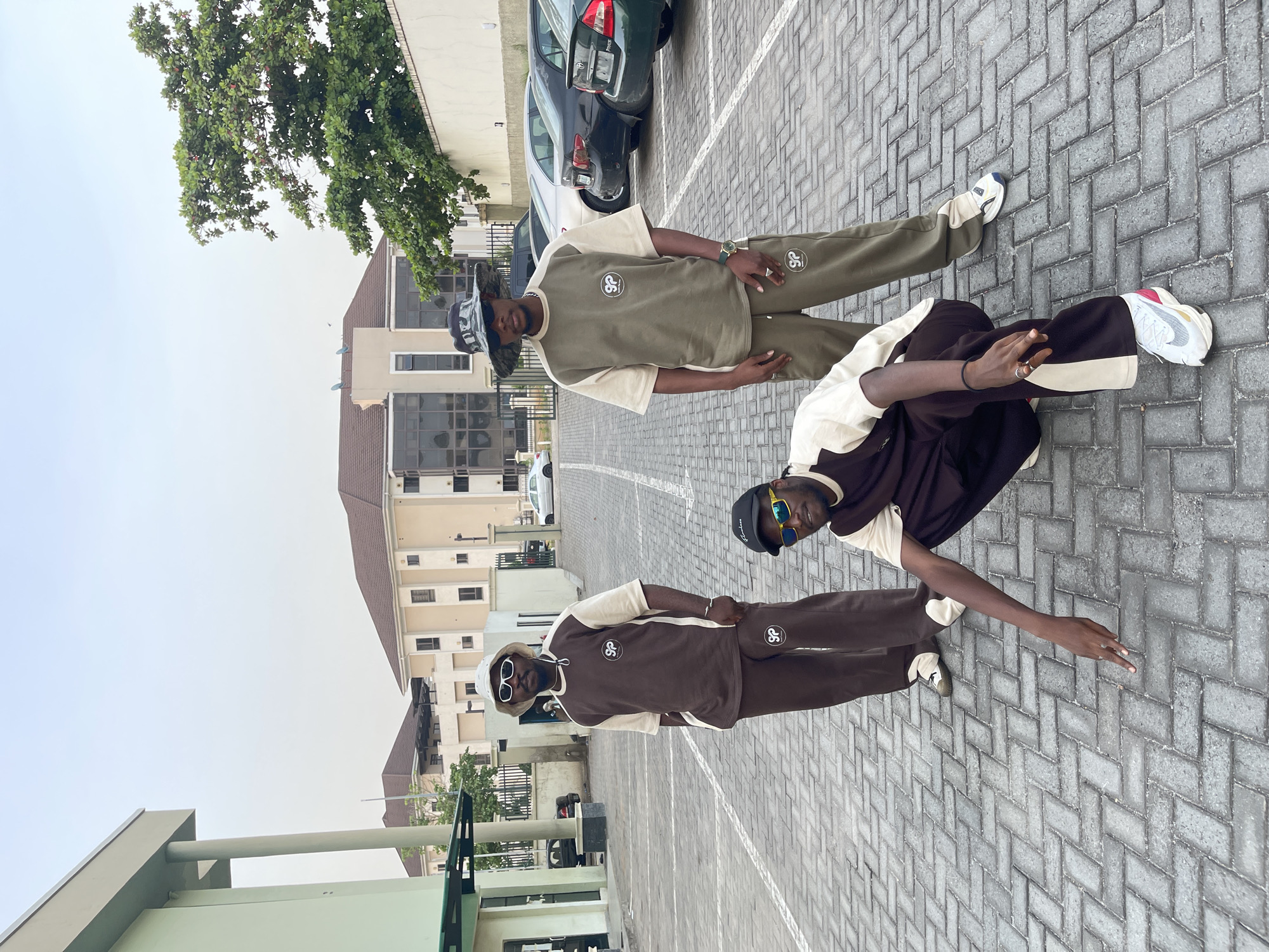 Young men pose for street style photos in Abuja