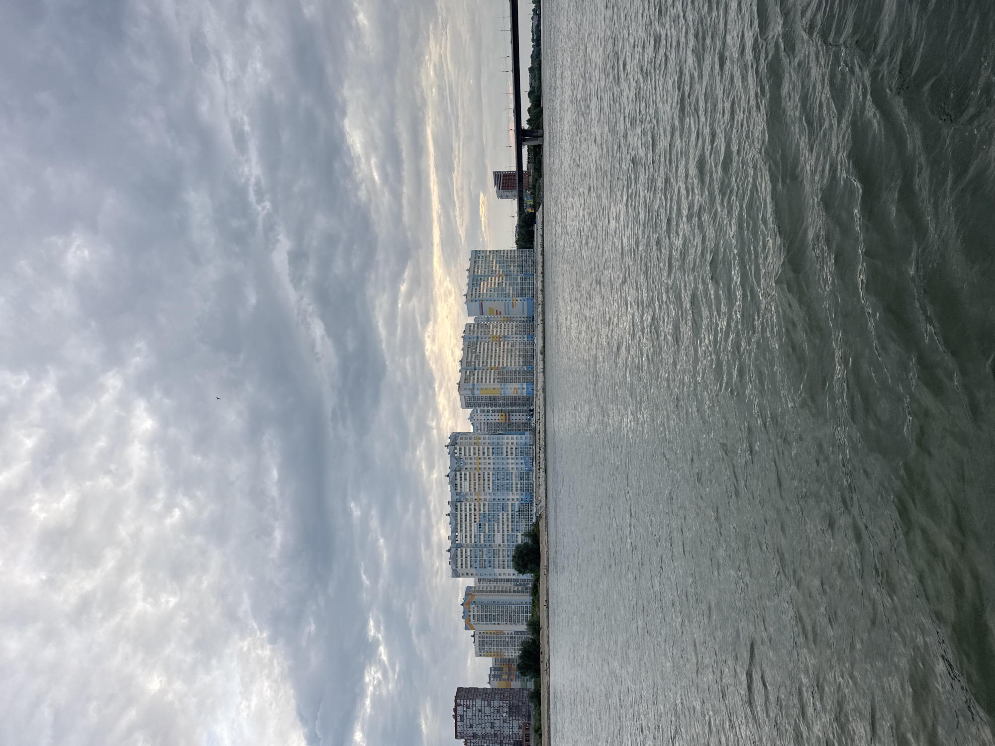 On the Ob River, Novosibirsk skyline and port under overcast skies