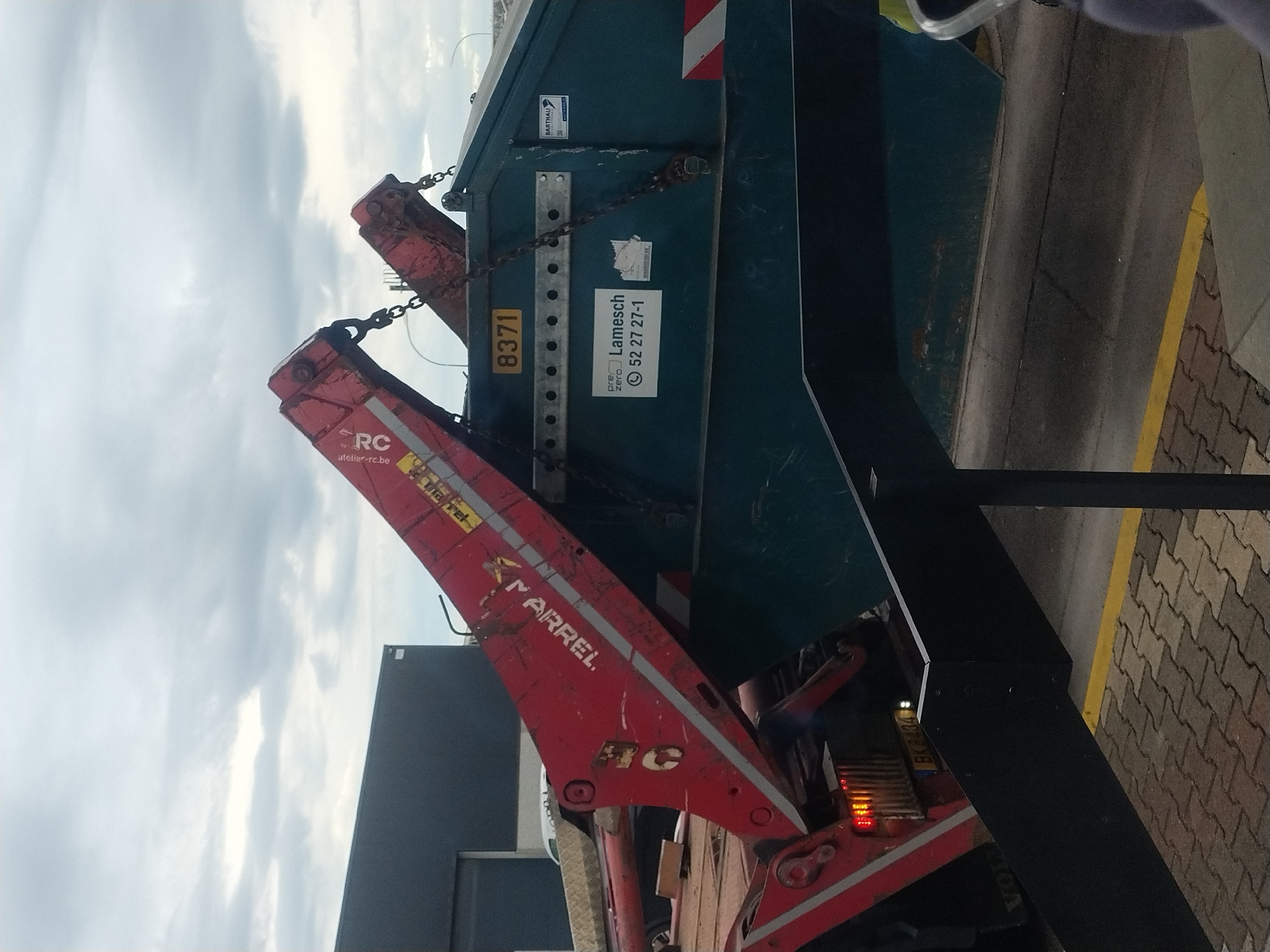 Industrial truck operations documented in rainy Luxembourg morning