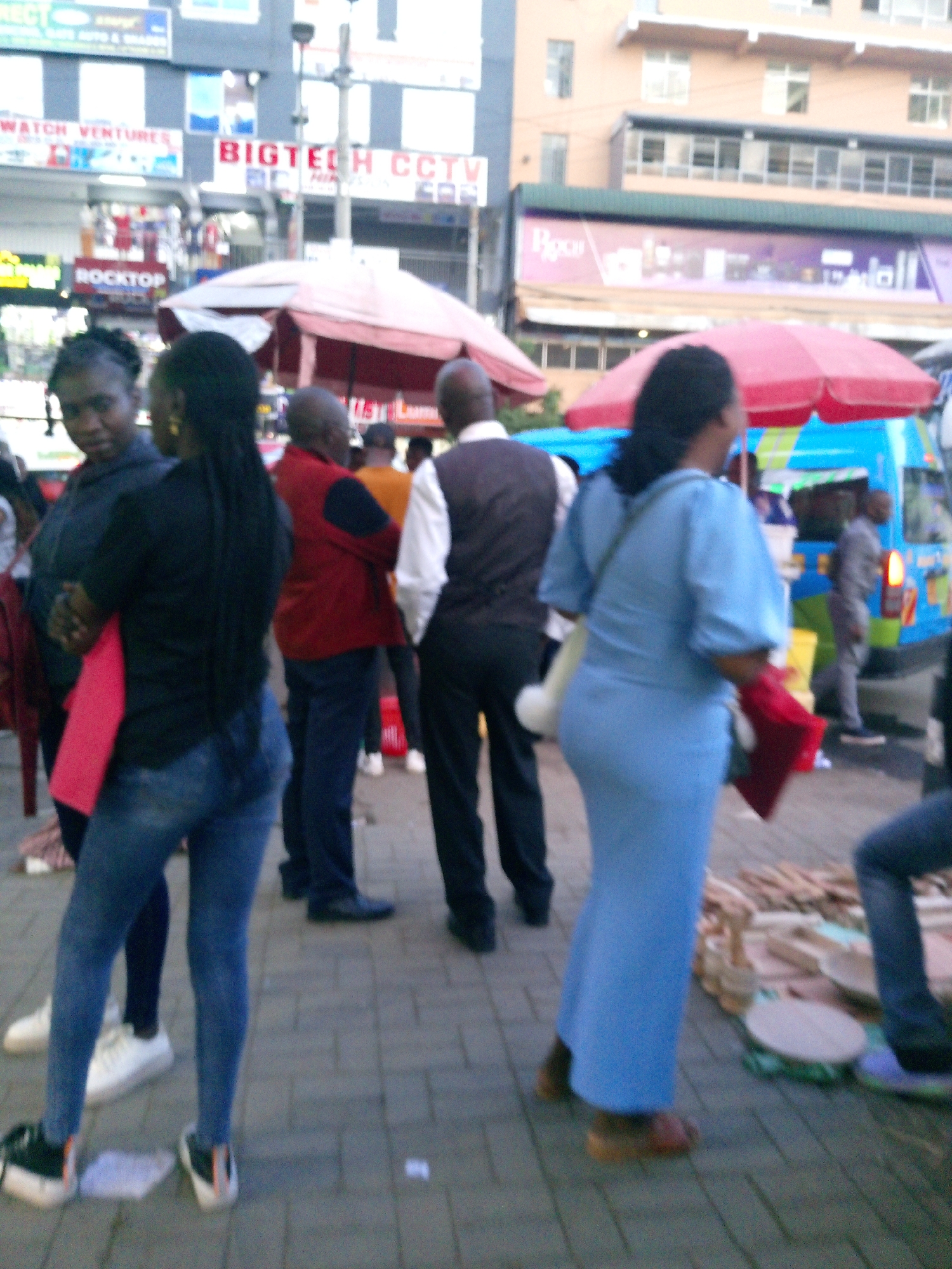Street scenes show daily commercial life across Nairobi