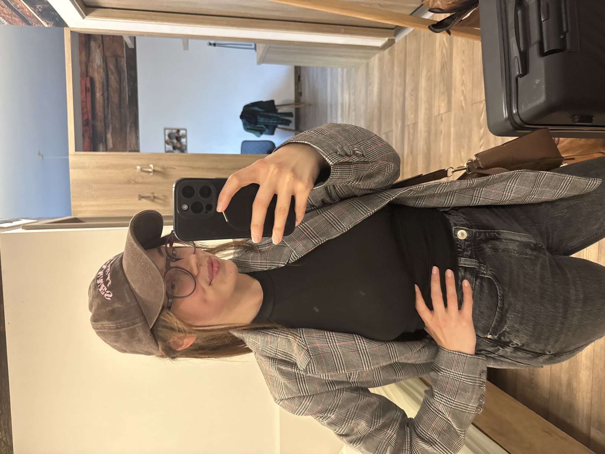 Woman documents casual afternoon with selfies in Budapest apartment