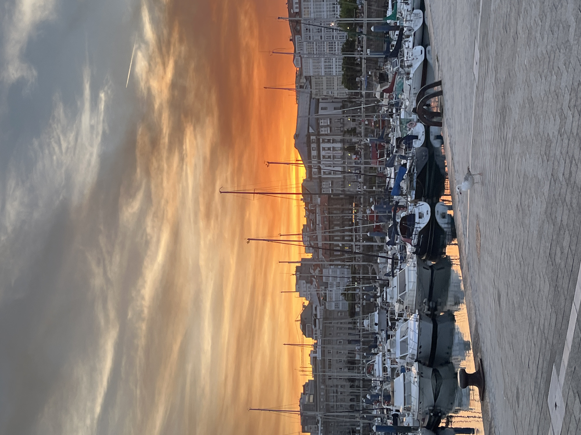 Spectacular sunset illuminates A Coruña marina and waterfront