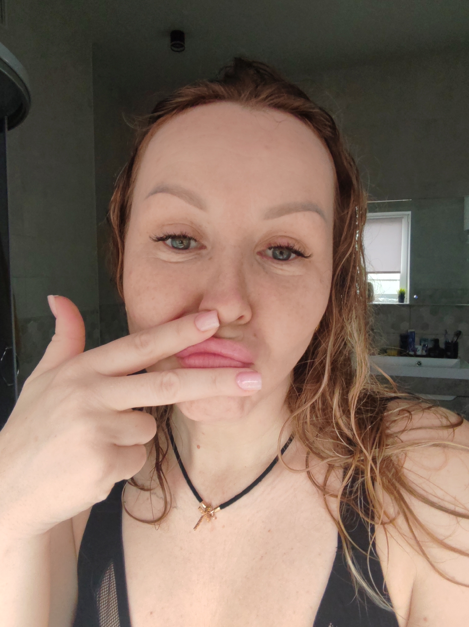 Woman photographed in bathroom and kitchen in Chaikovsky, Russia