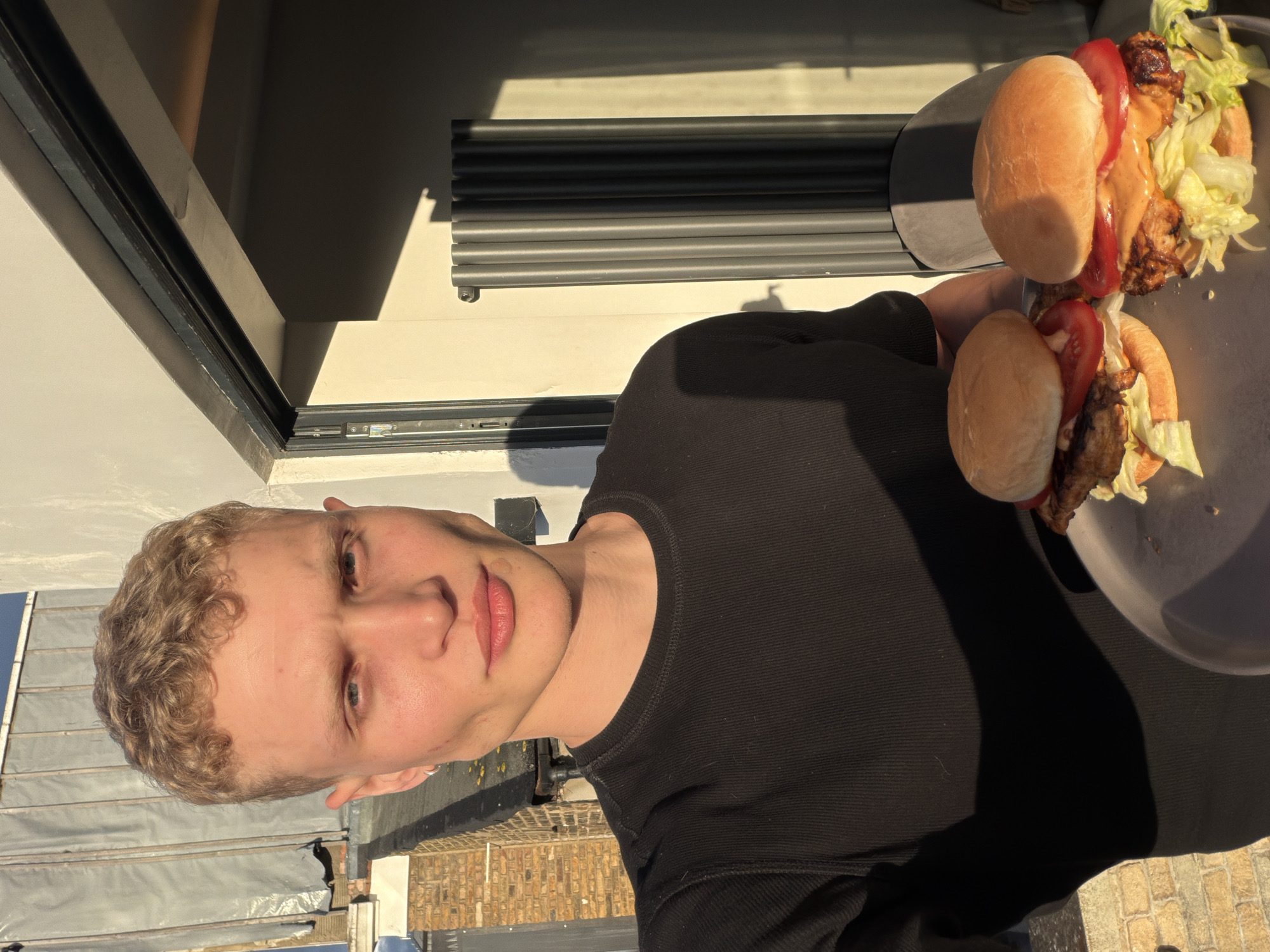 Young man spotted on London rooftop terrace evening