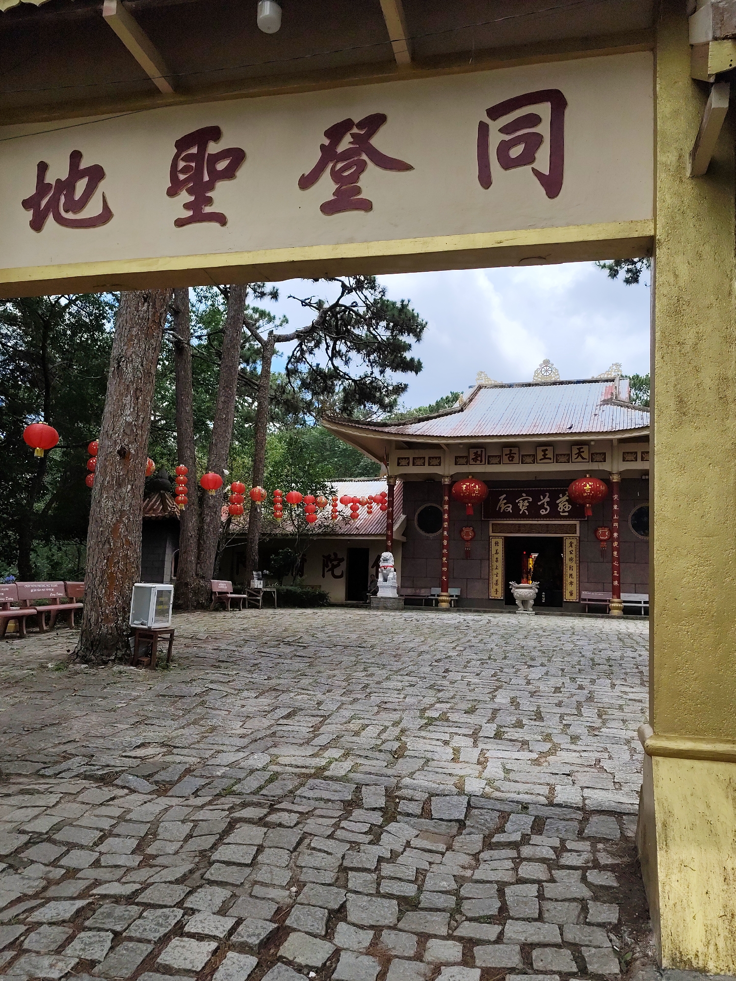 Early morning documentation captures Buddhist temple and residential architecture in Da Lat