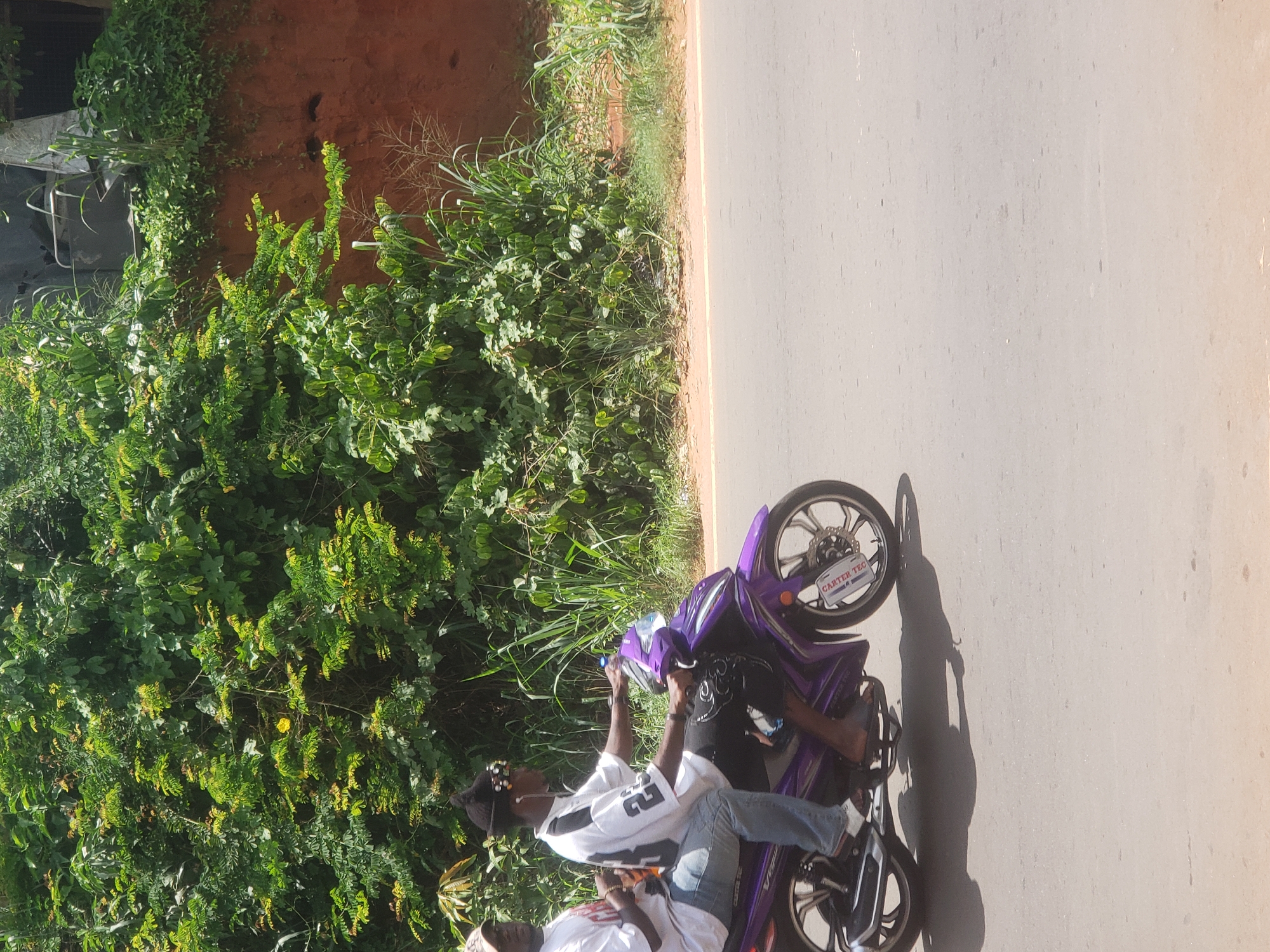 Purple motorcycle riders, man with truck observed in suburban area