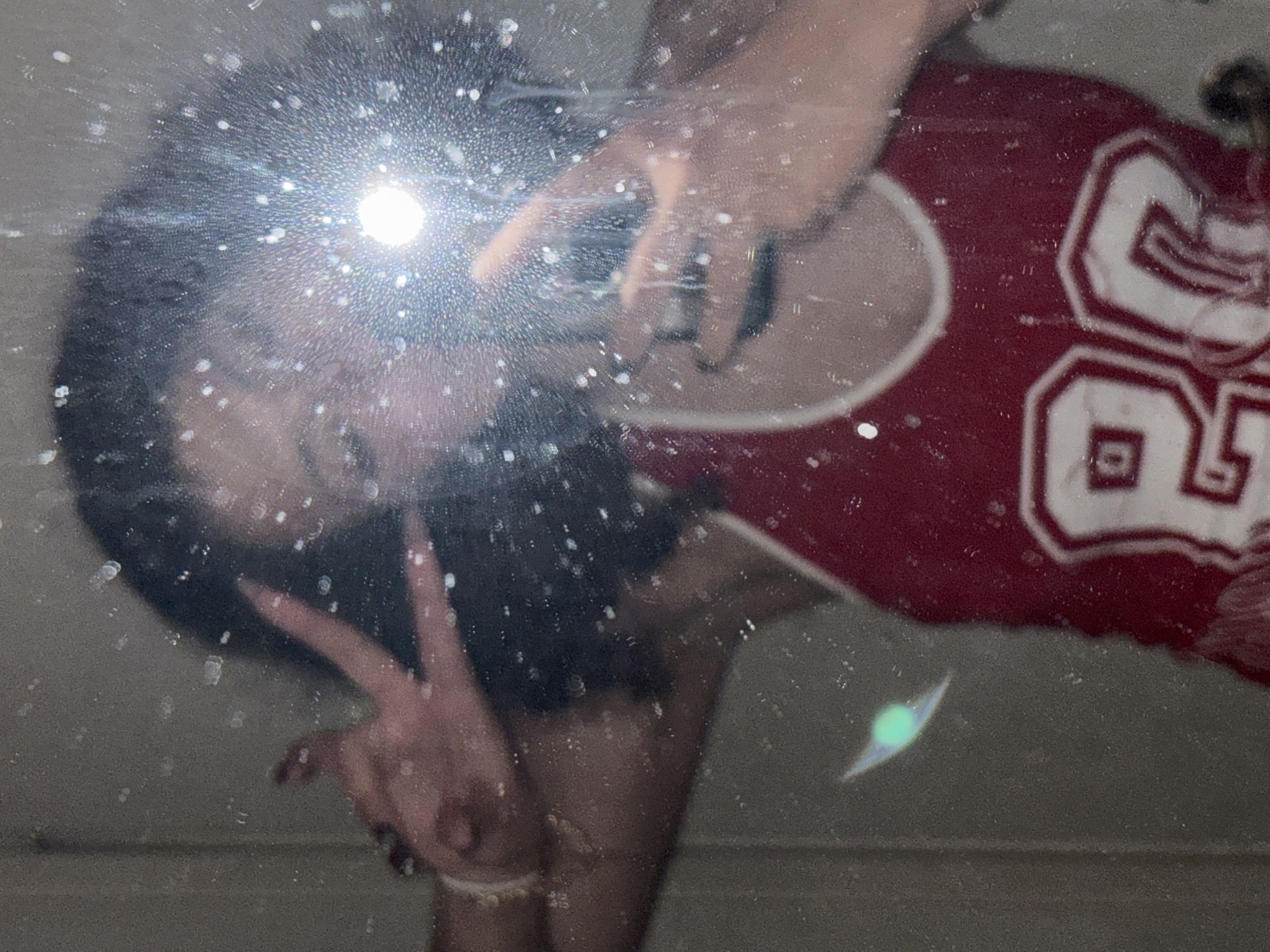 Mirror selfie captured in Milan featuring red jersey number 80