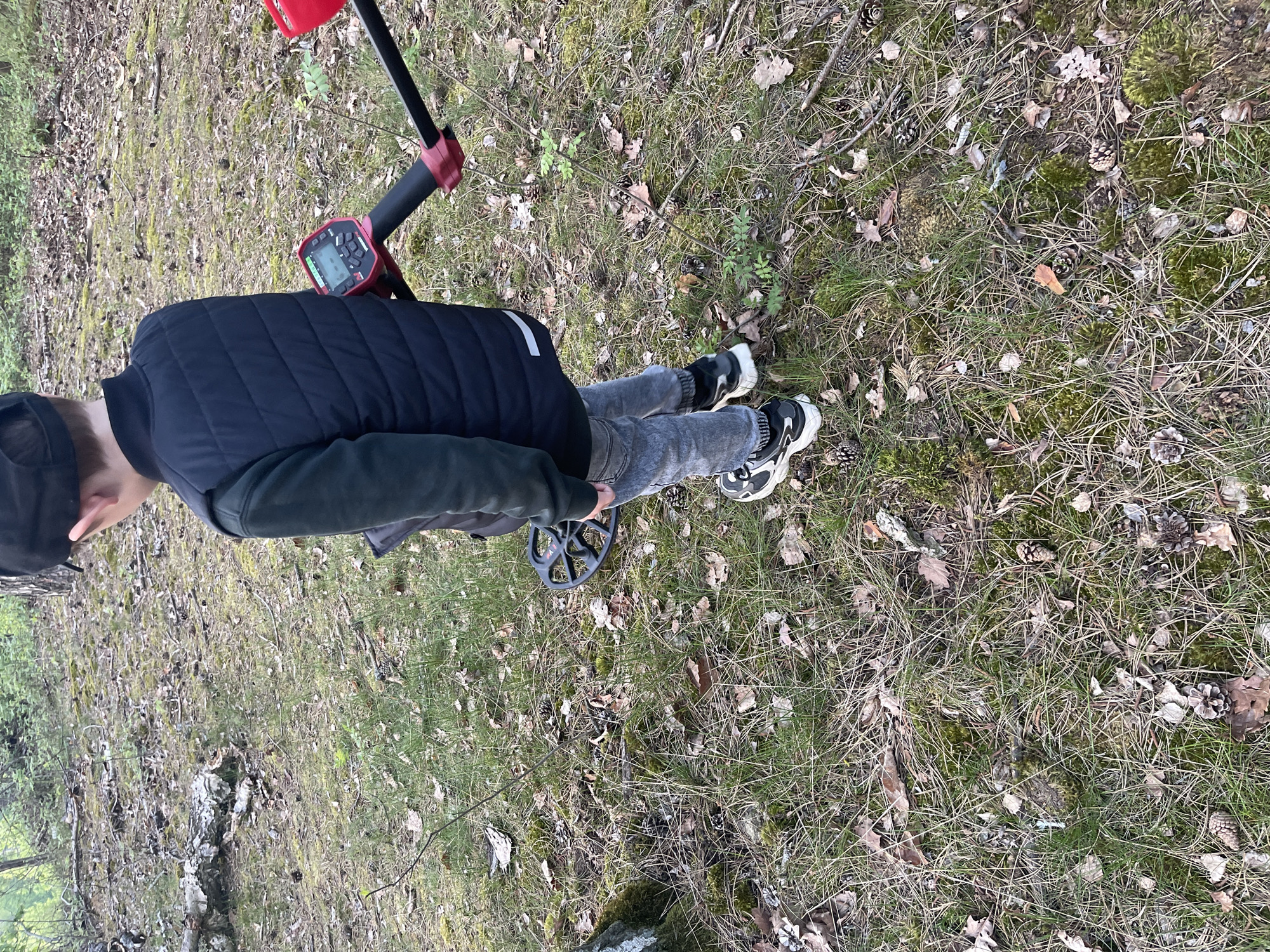 Metal detector enthusiast searches forests near Jíloviště, Czechia