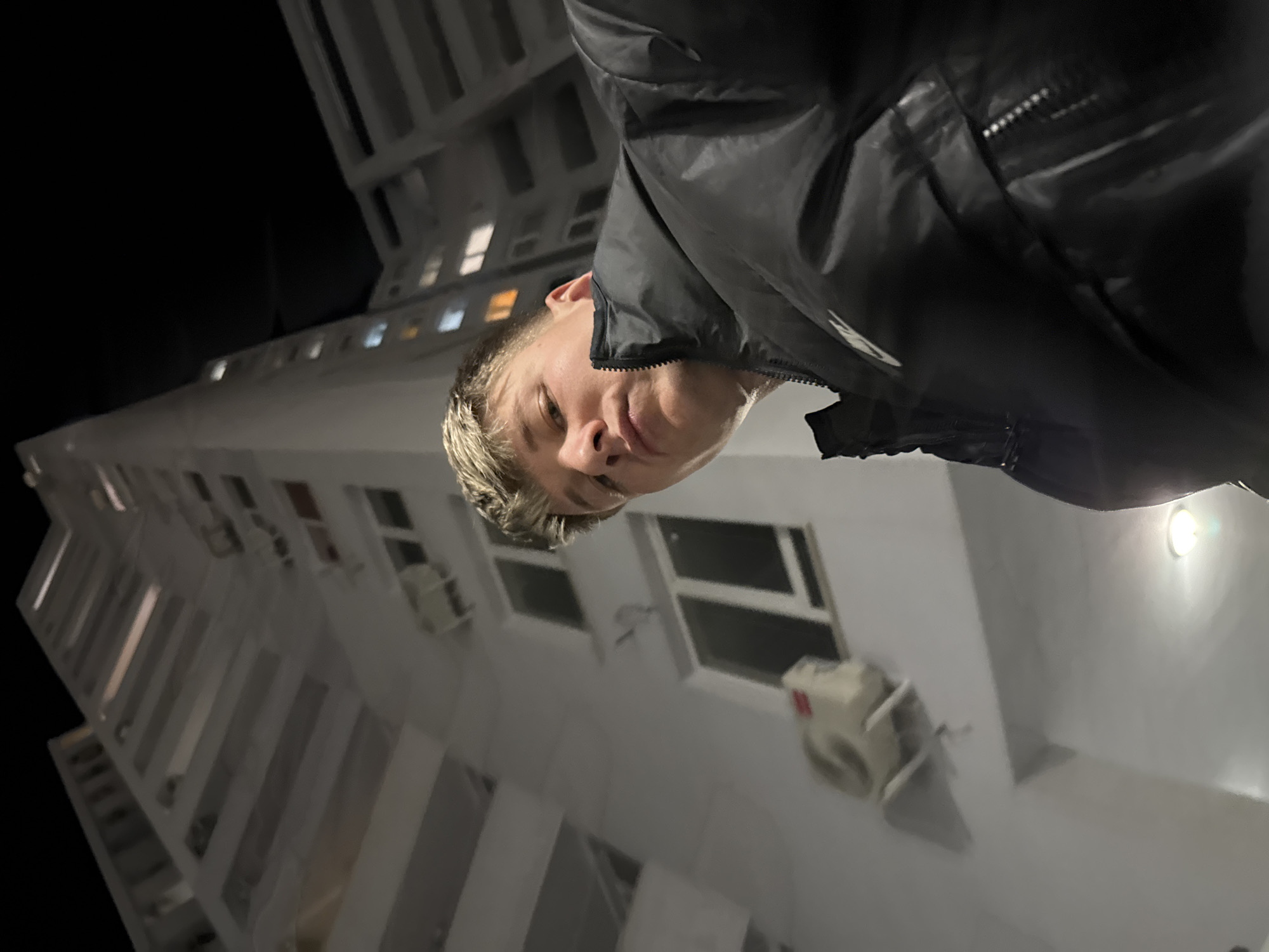 Young man takes playful selfies in Plovdiv building
