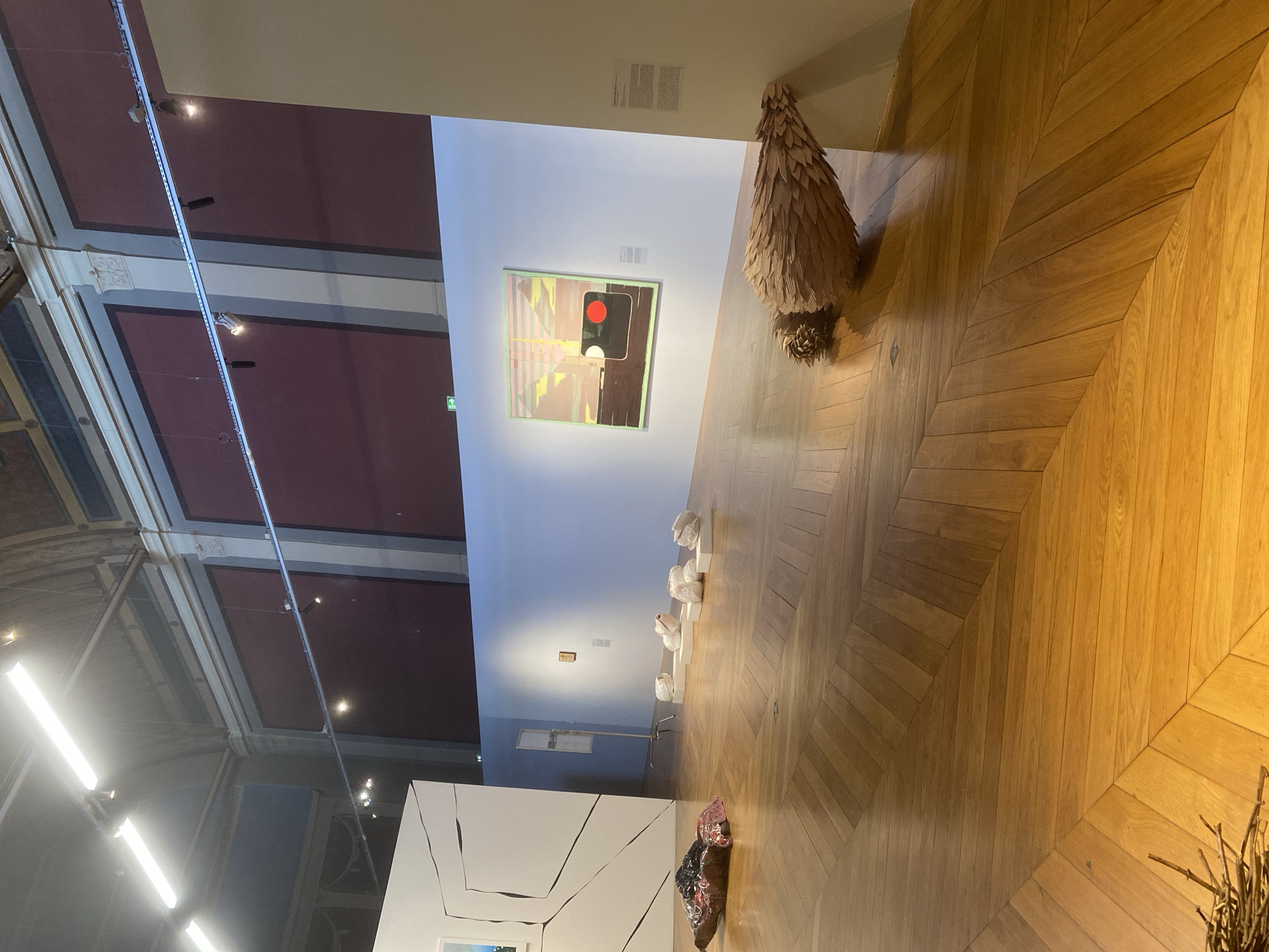 Gallery interior with herringbone flooring documented in Paris
