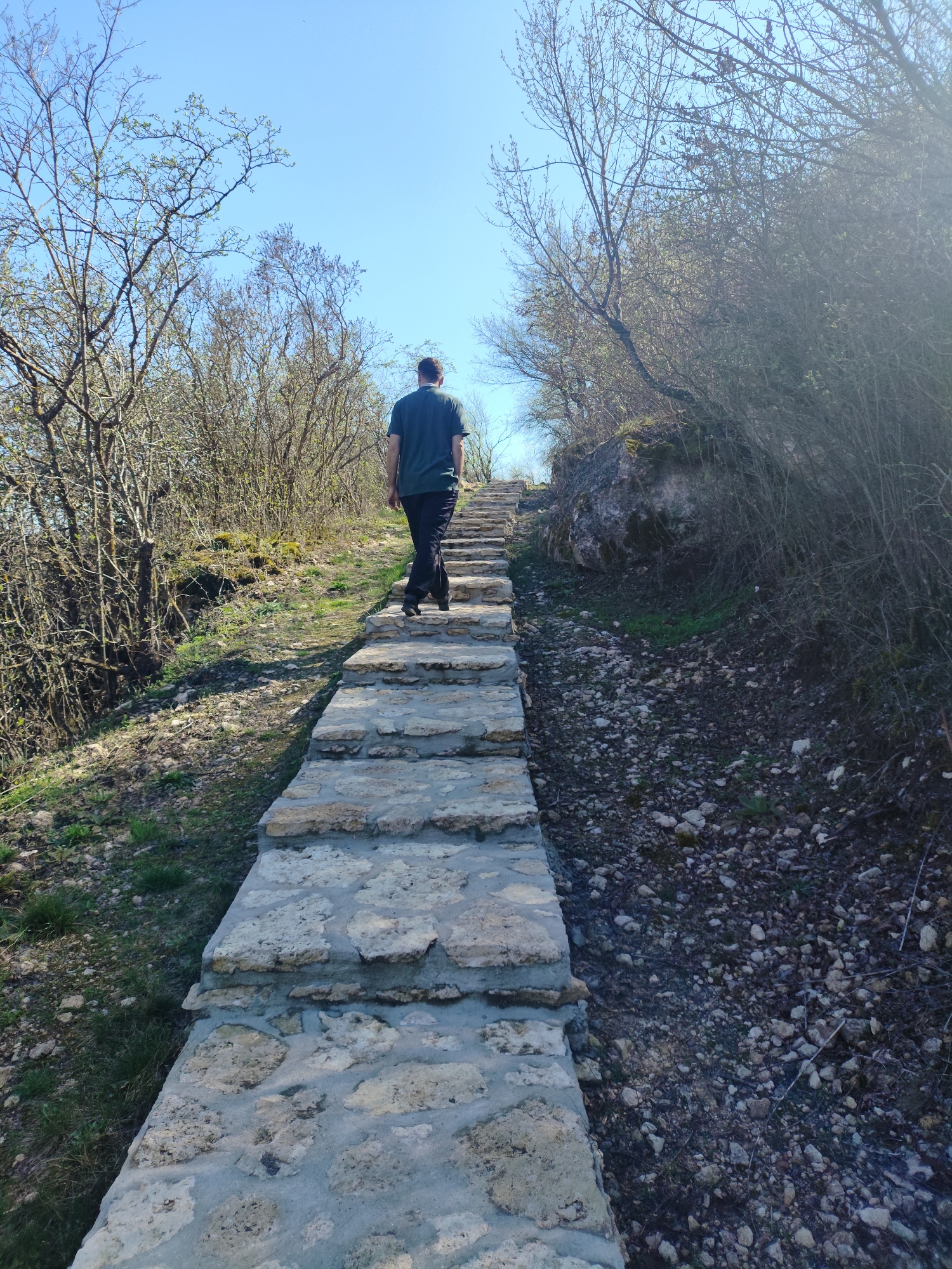 Person climbs stone steps in Stroiesti, Moldova