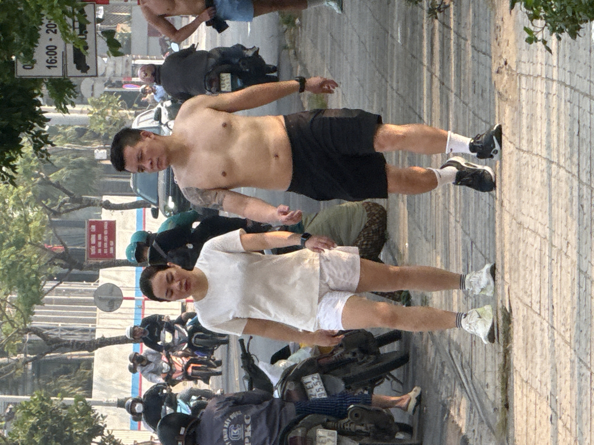 Two men spotted on sidewalk in Đà Nẵng, Vietnam