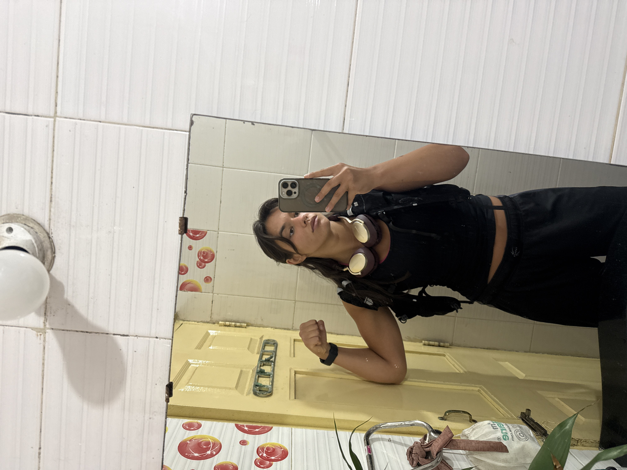 Young person takes bathroom mirror selfie in Marra, India