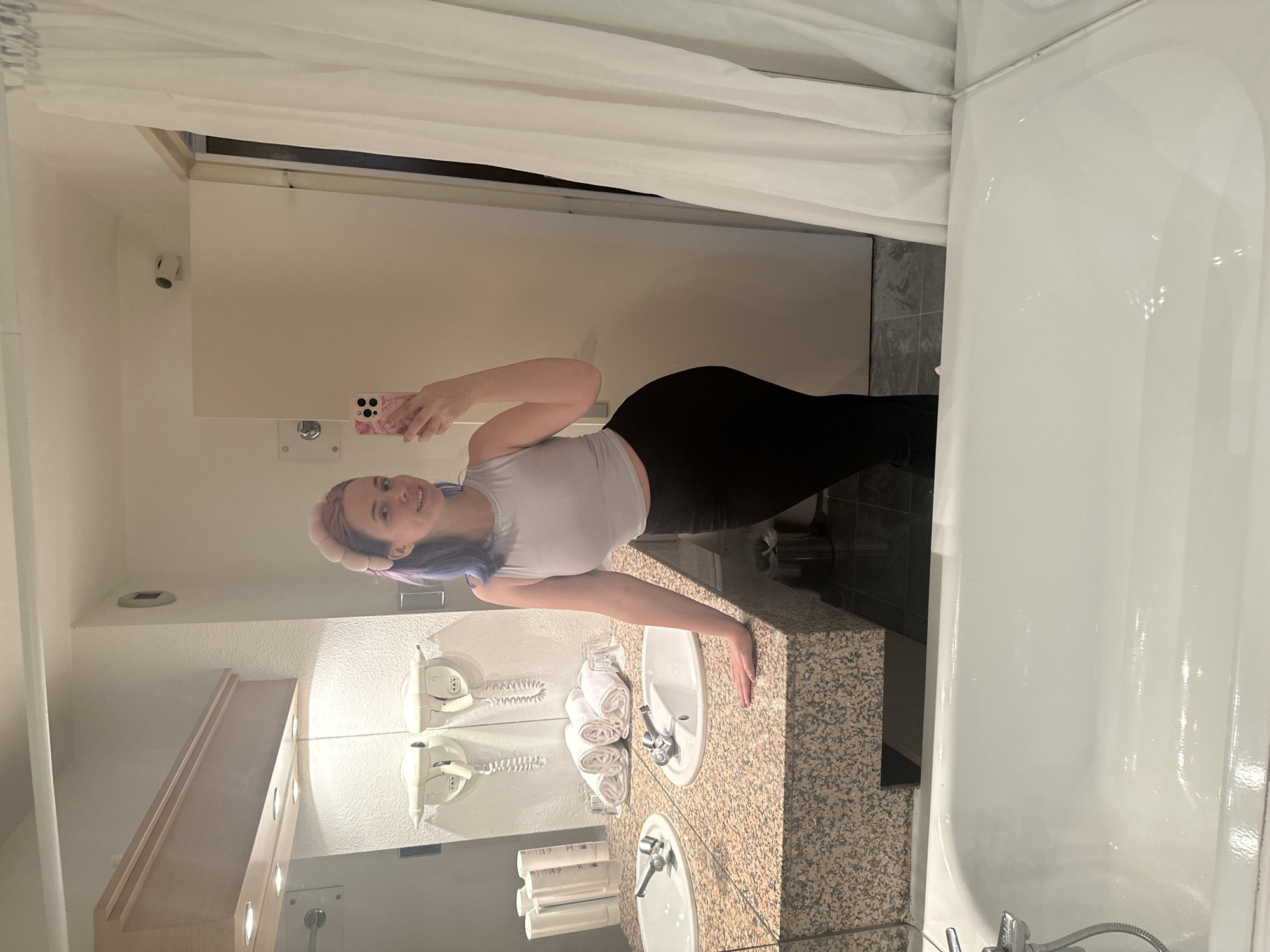 Woman takes selfies in bathroom, elevator in French suburb