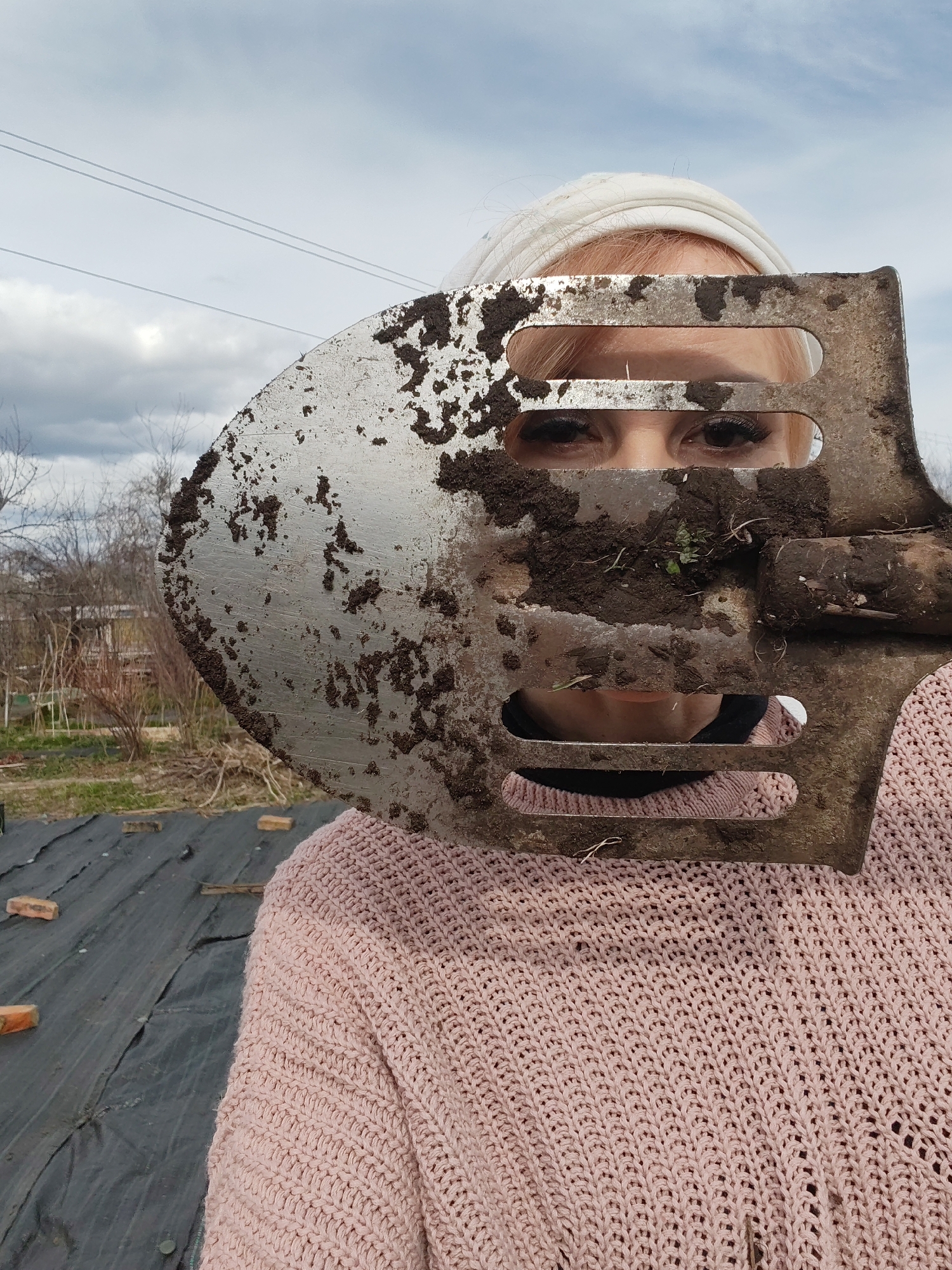 Woman documents spring gardening session in Chaikovsky, Russia