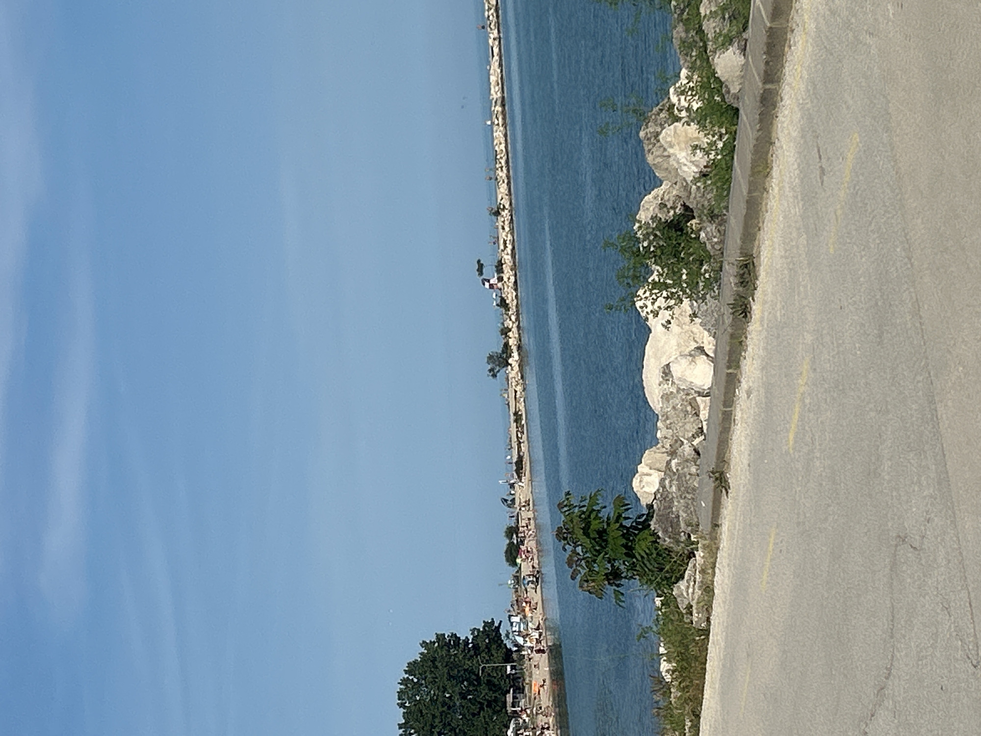 Coastal waterfront pathway documented in brief observation sequence