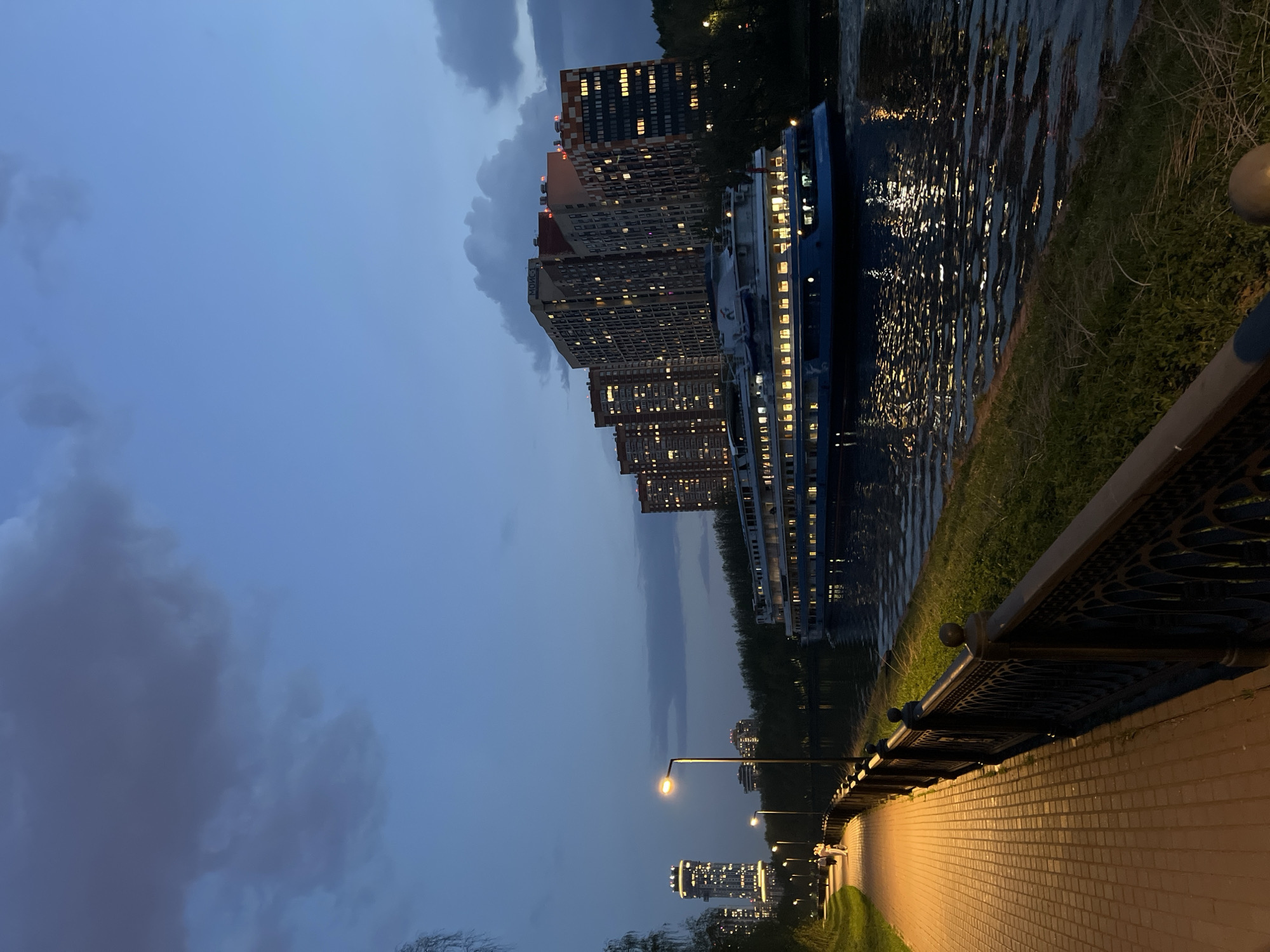 Evening stroll captured along Khimki waterfront walkway