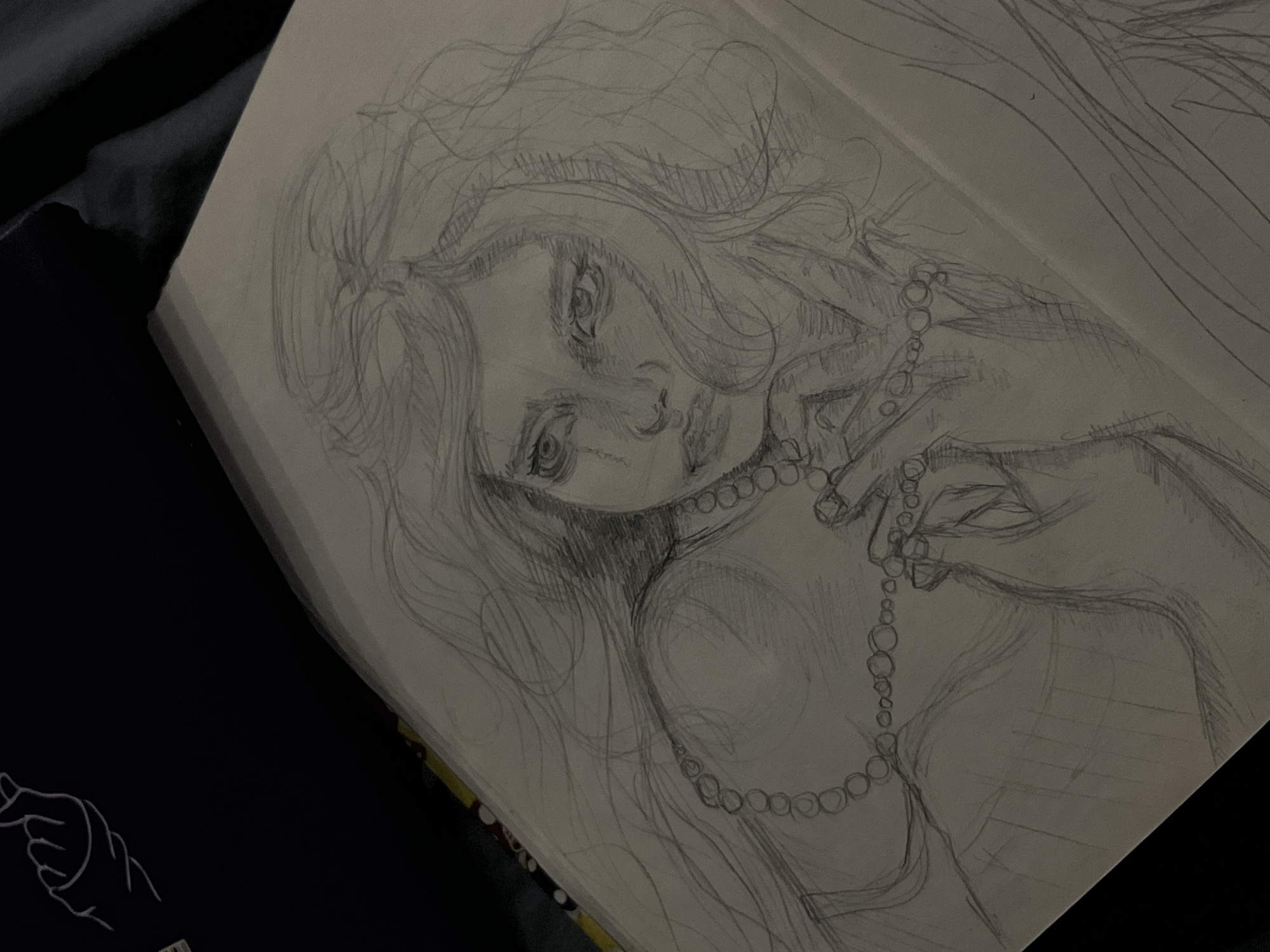 Sketchbook art session: portraits, paintings, and creative workspace