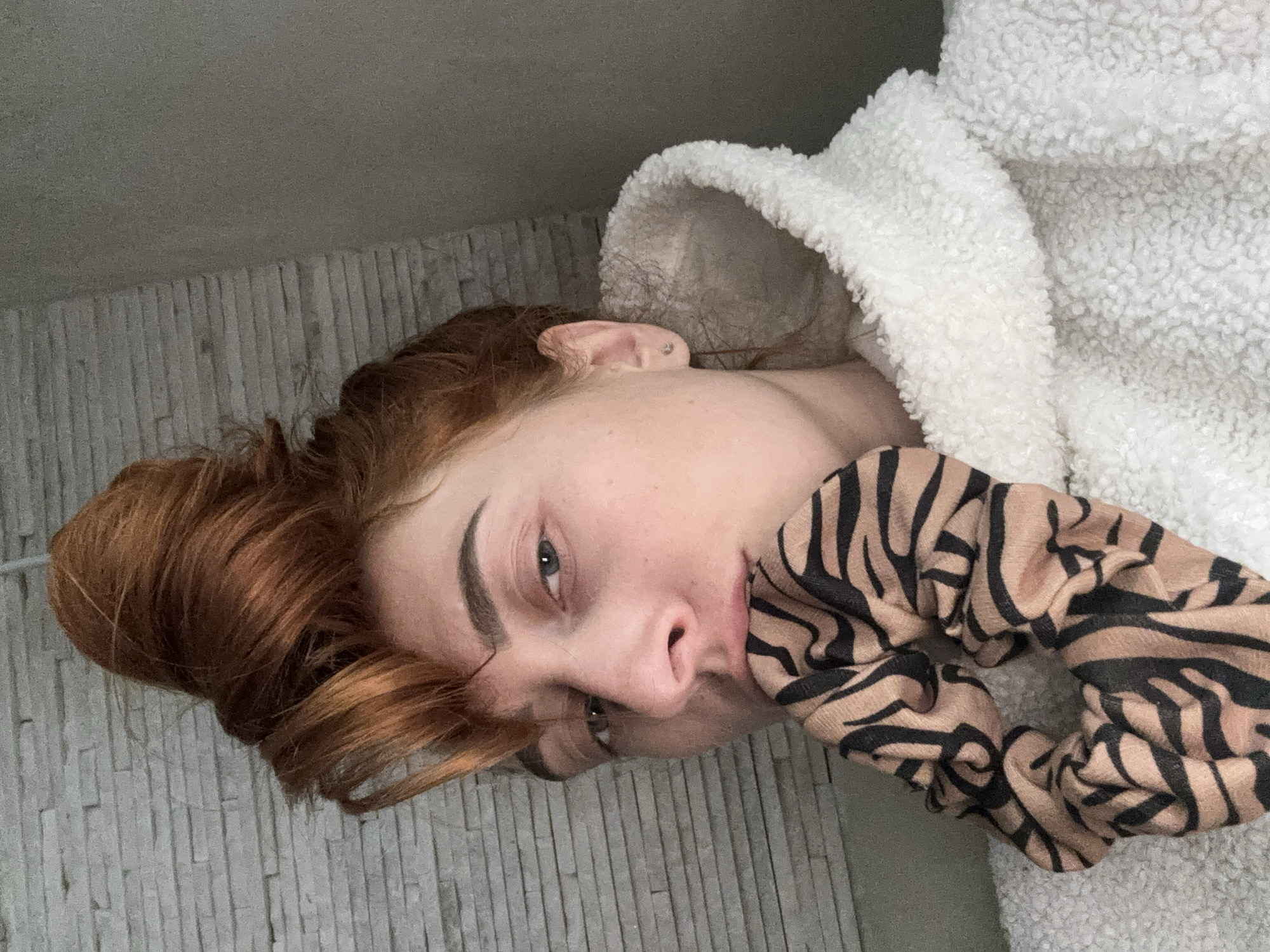 Woman documents casual indoor moments with hair styling in Budva