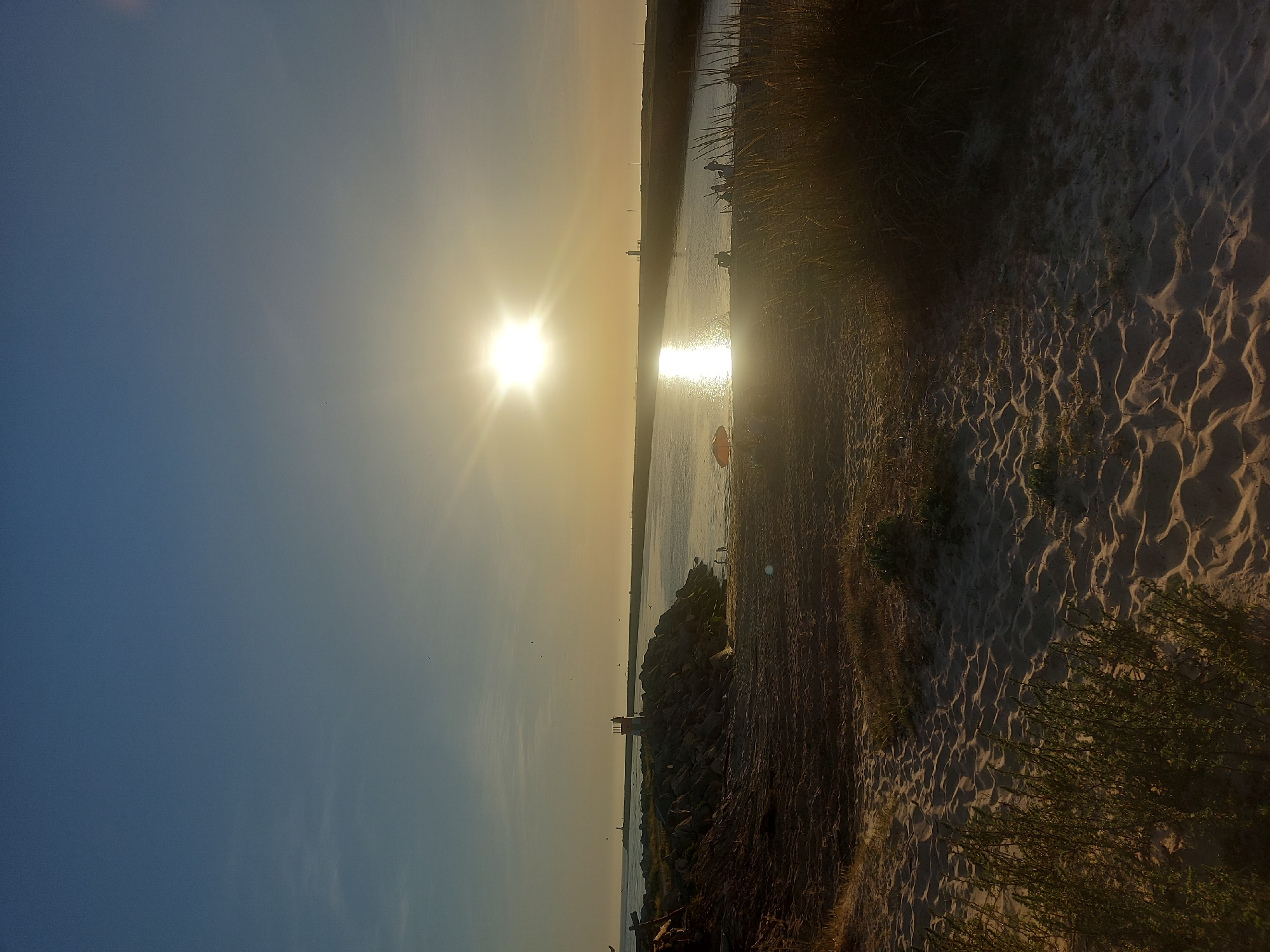 Evening sunset walk documented along Mondego River in Portugal