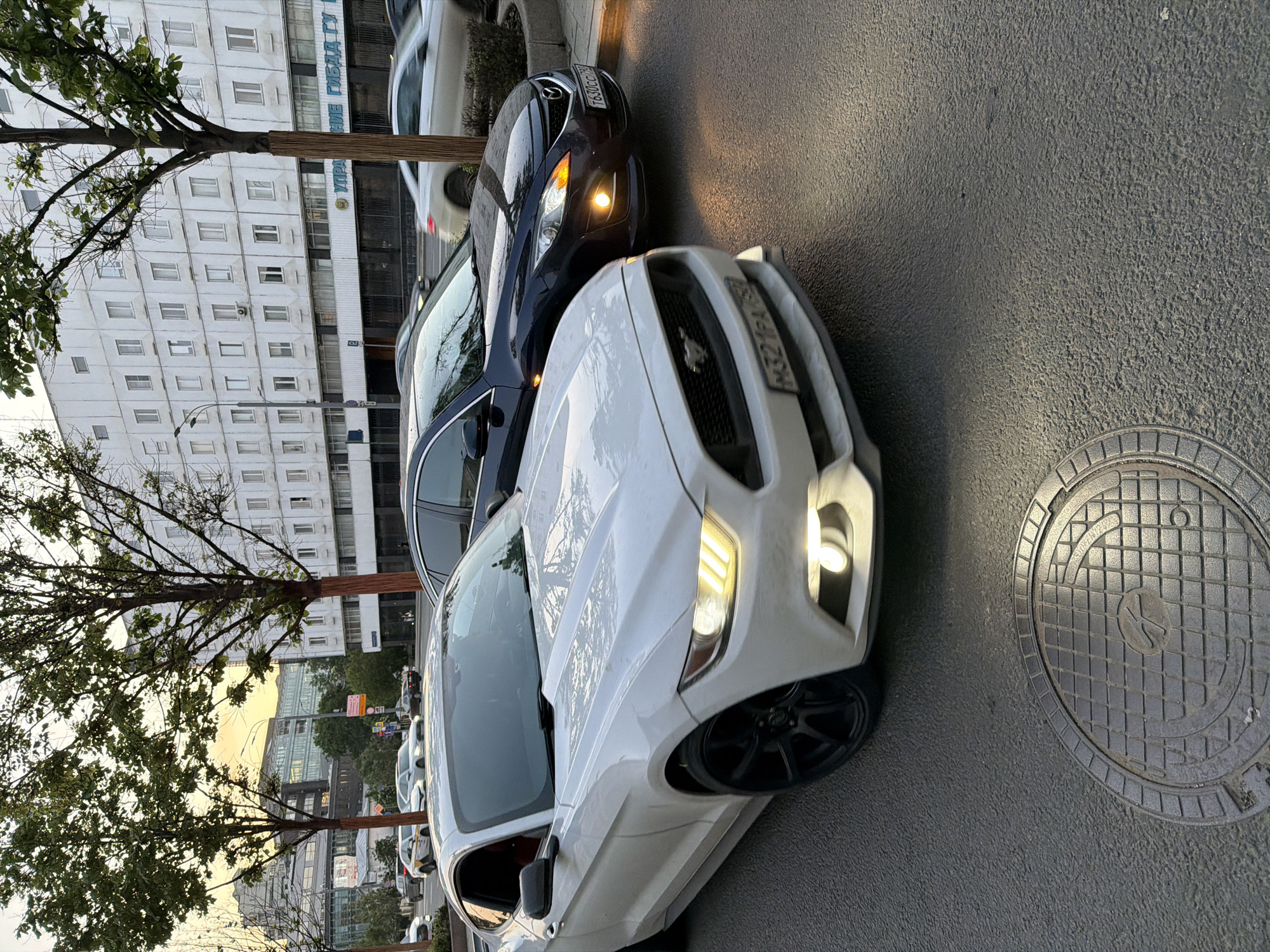 Two cars with Russian plates parked on Moscow street